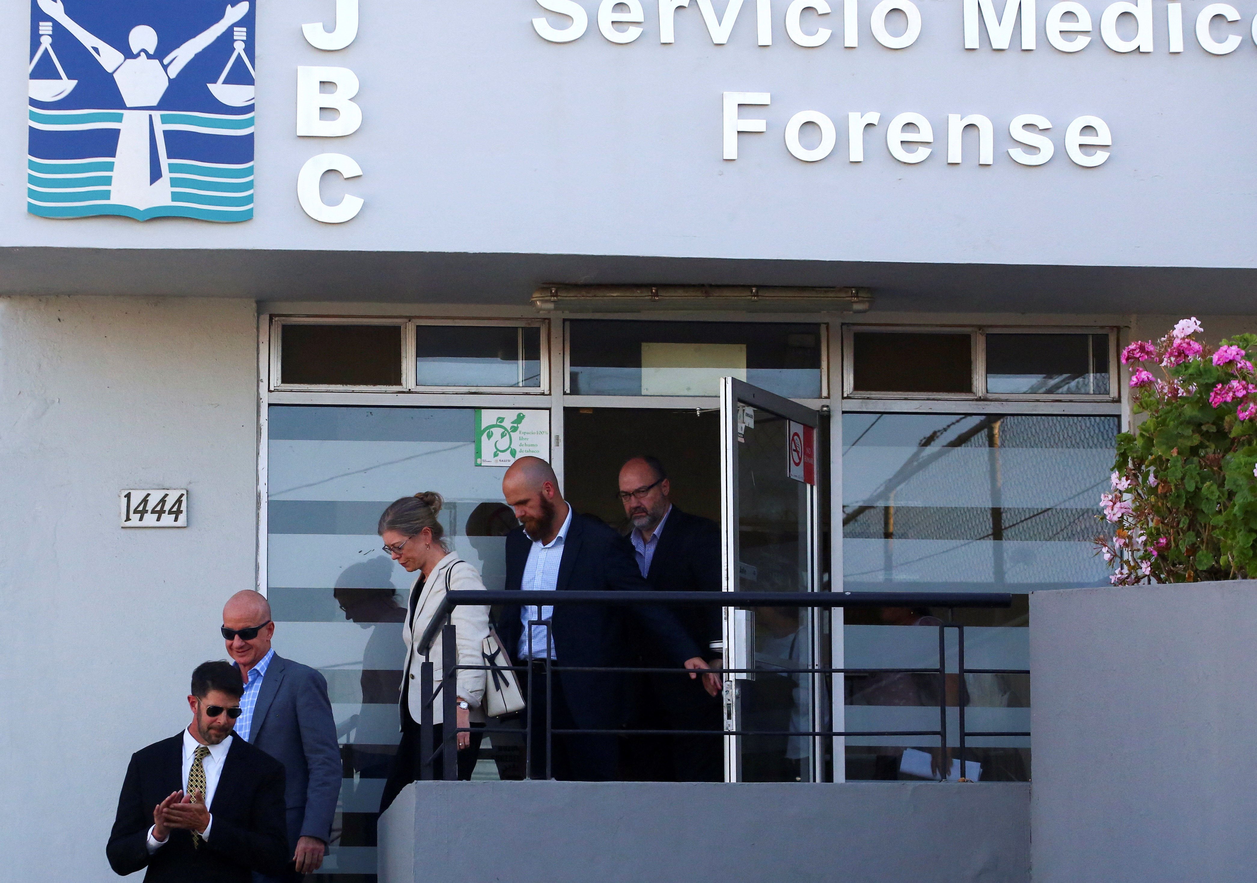 Members of the United States and Australian embassies and the parents of missing U.S. and Australian tourists leave the Forensic Medical Service in Ensenada