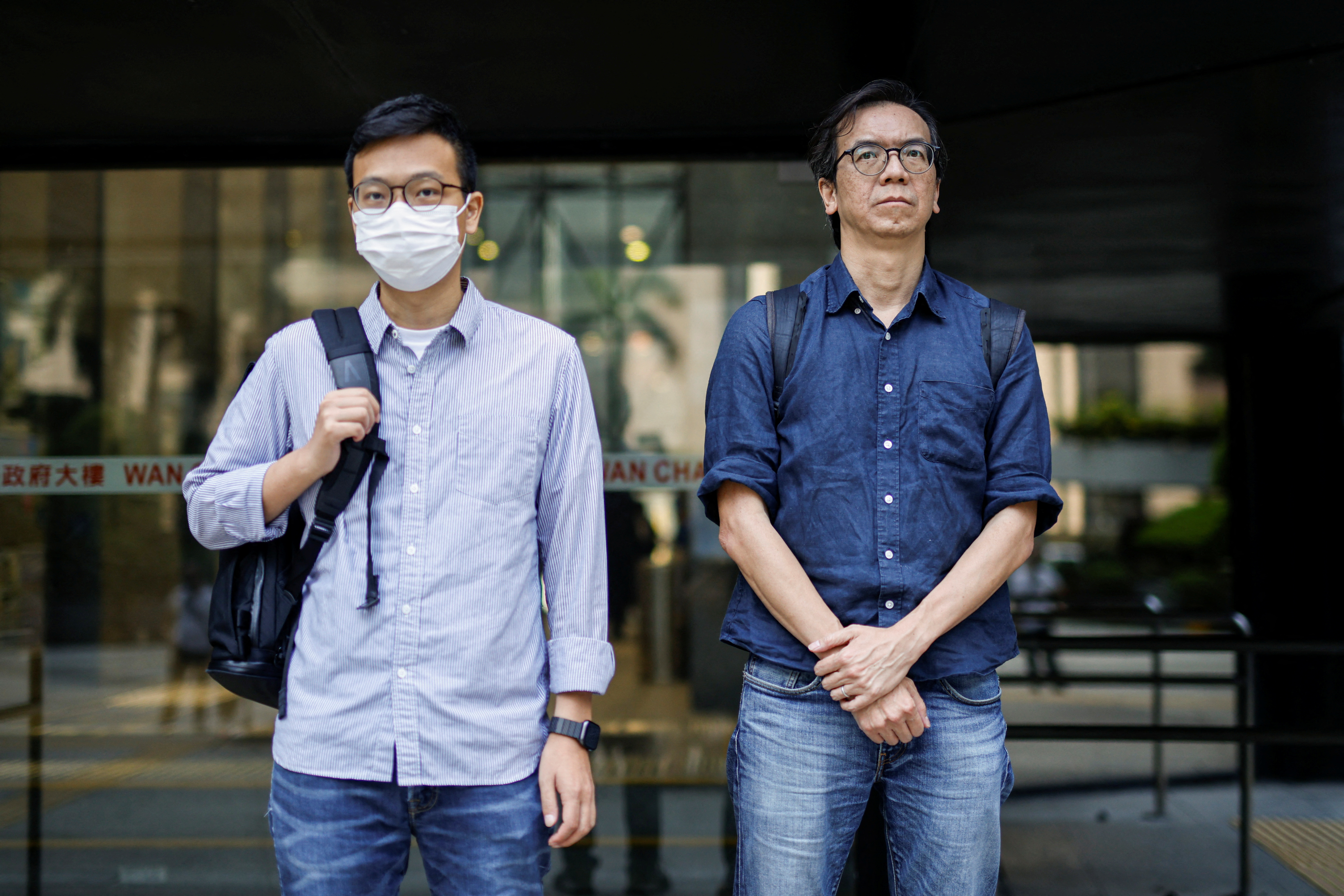 Chung Pui-kuen, former chief editor of the now-shuttered Stand News, and Patrick Lam, former acting chief editor, leave the District Court in Hong Kong