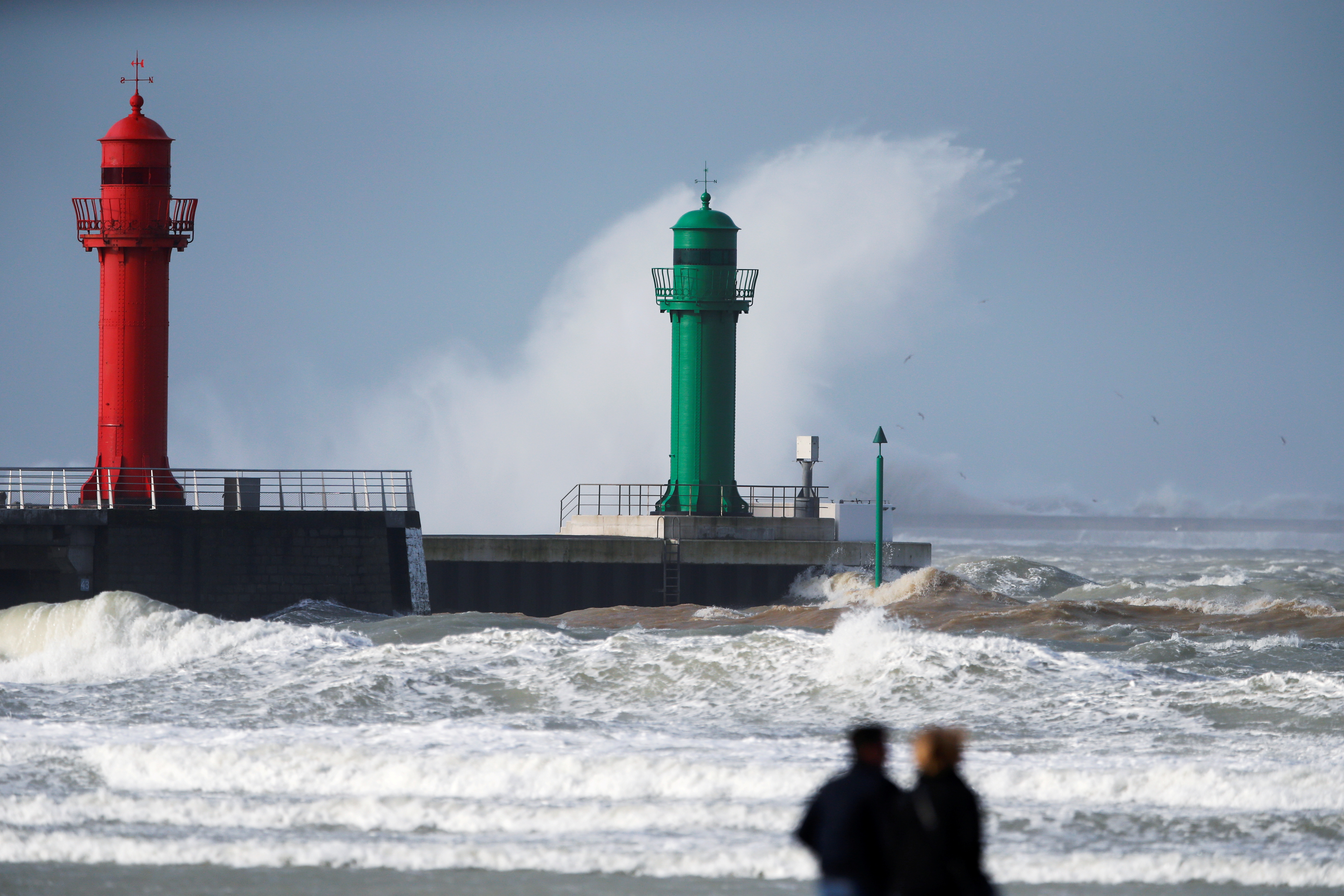 Waves crash against lighthouses during Storm Ciara at Boulogne-sur-Mer, France, February 10, 2020.  REUTERS/Pascal Rossignol/File Photo