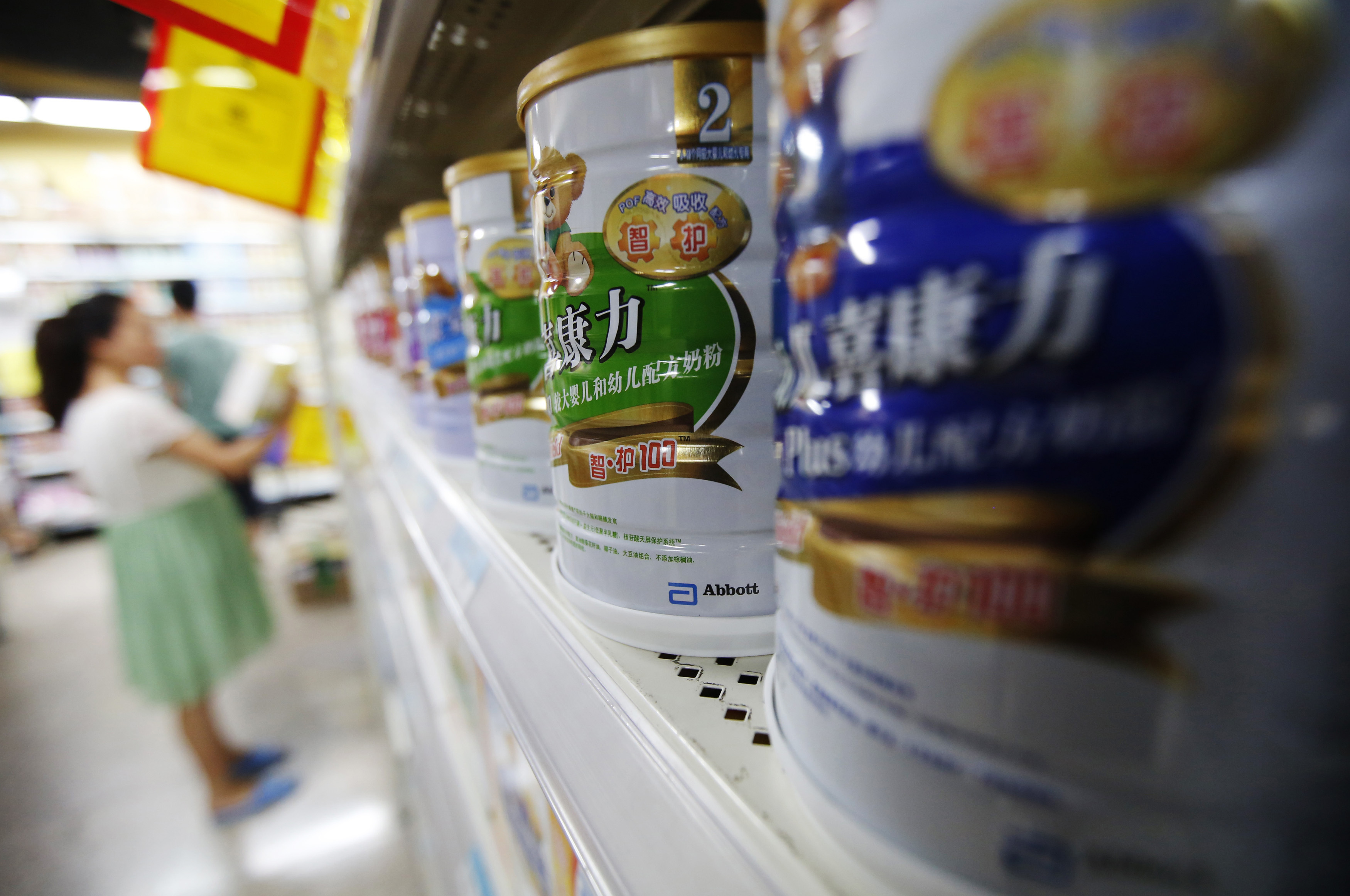 Abbott's milk powder products are displayed on a shelf at a supermarket in Beijing