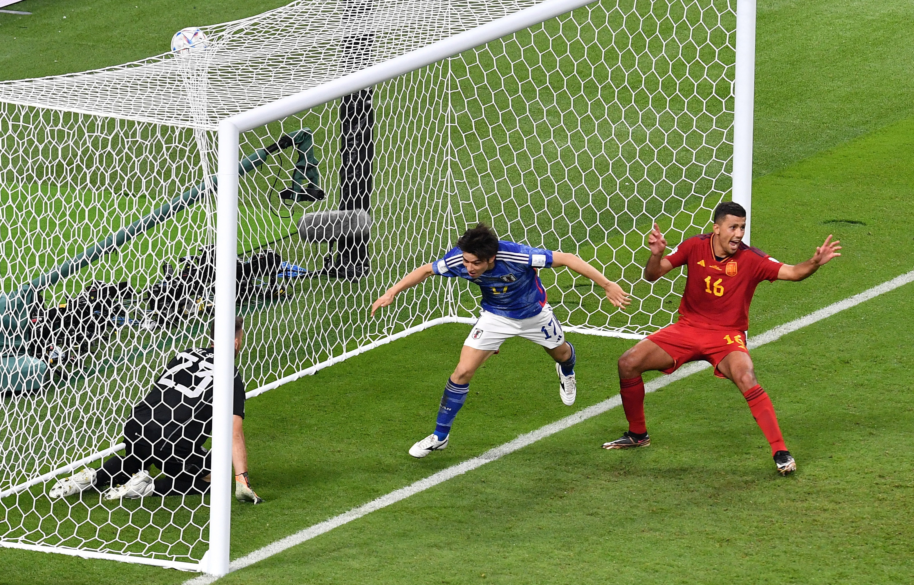 Japan roars back again to shock Spain and top group