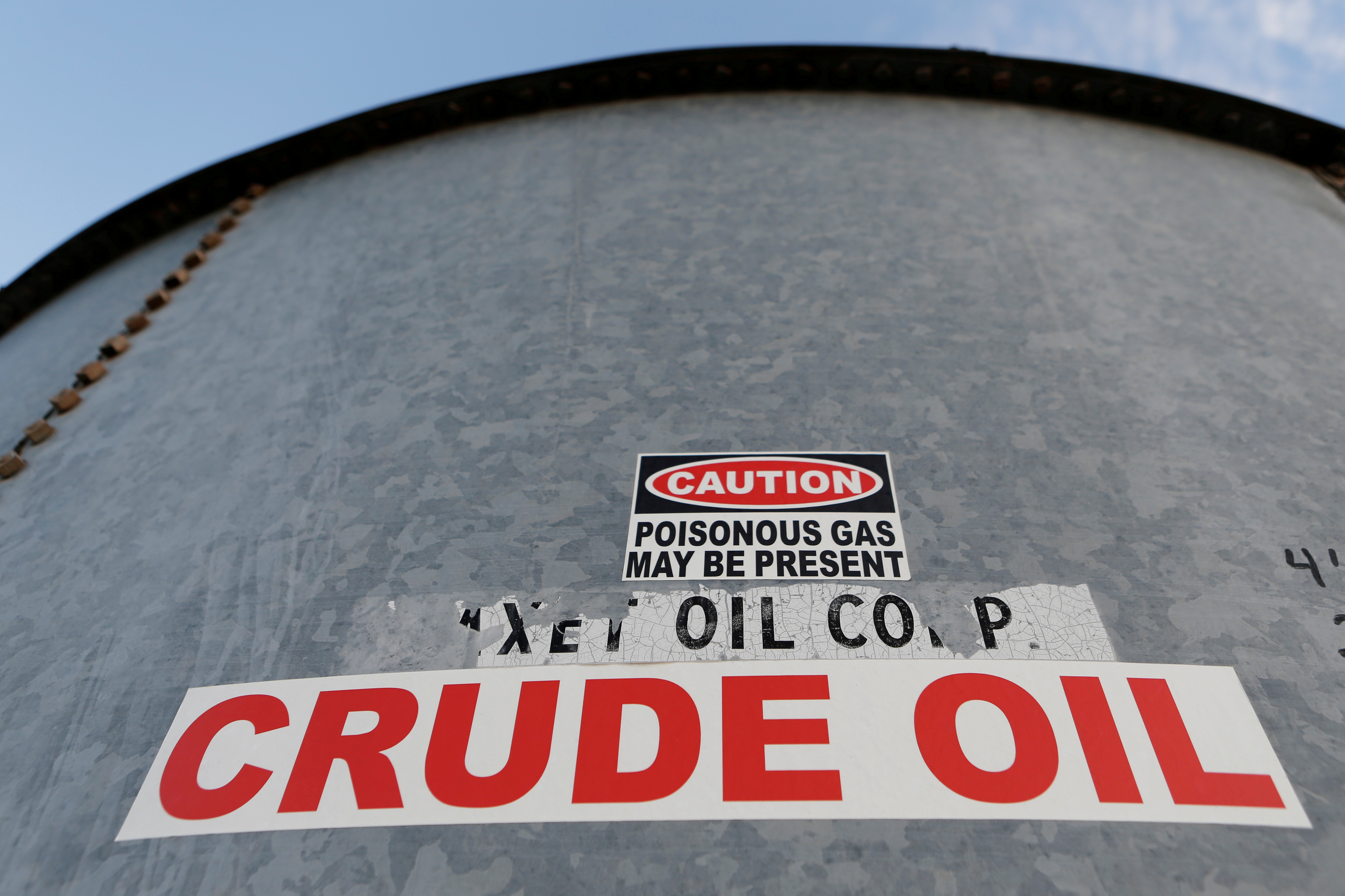 A sticker reads crude oil on the side of a storage tank in the Permian Basin in Mentone, Loving County, Texas, U.S. November 22, 2019. Picture taken November 22, 2019. REUTERS/Angus Mordant