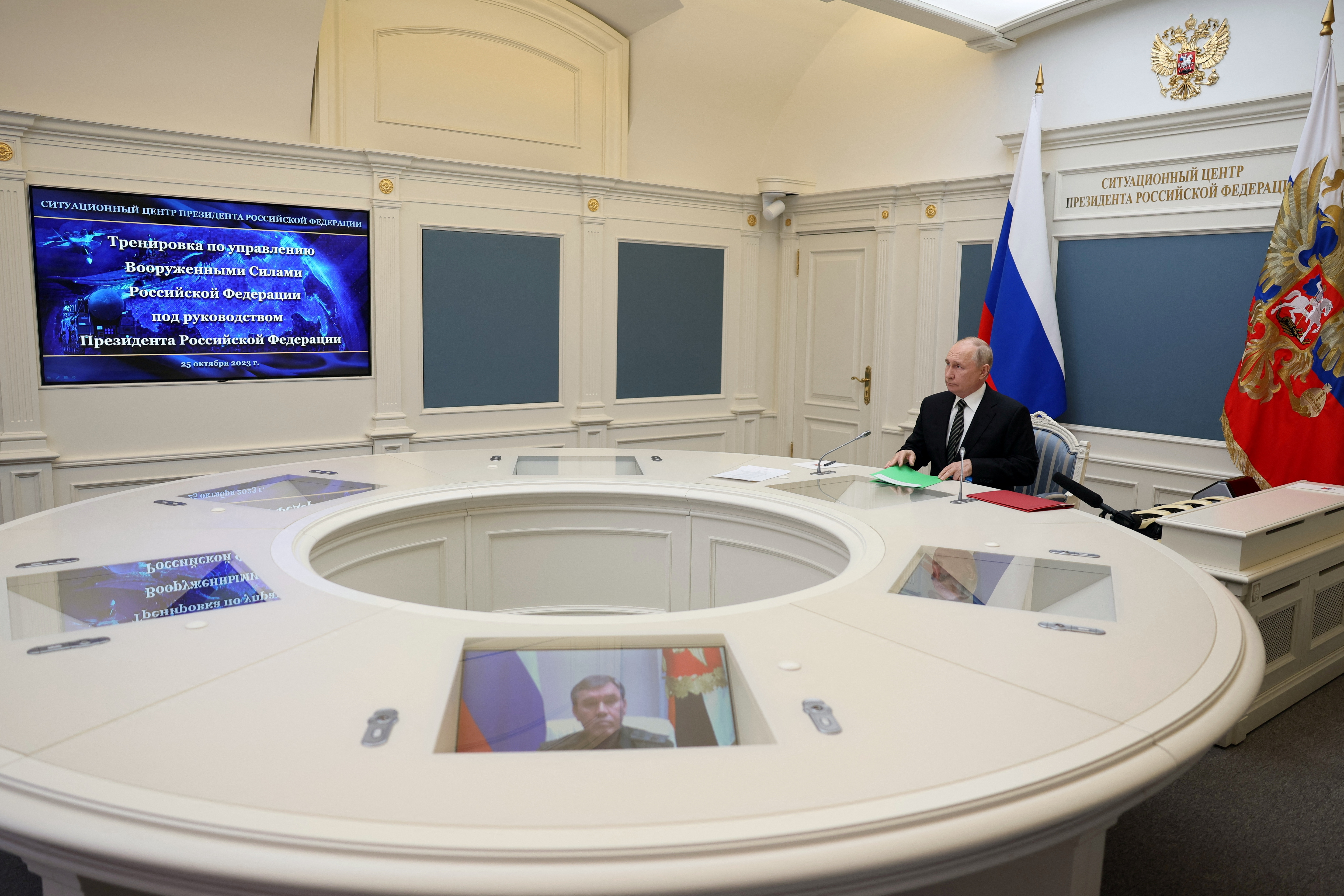 Russian President Putin inspects an exercise to test delivering a massive retaliatory nuclear strike via a video link from Moscow