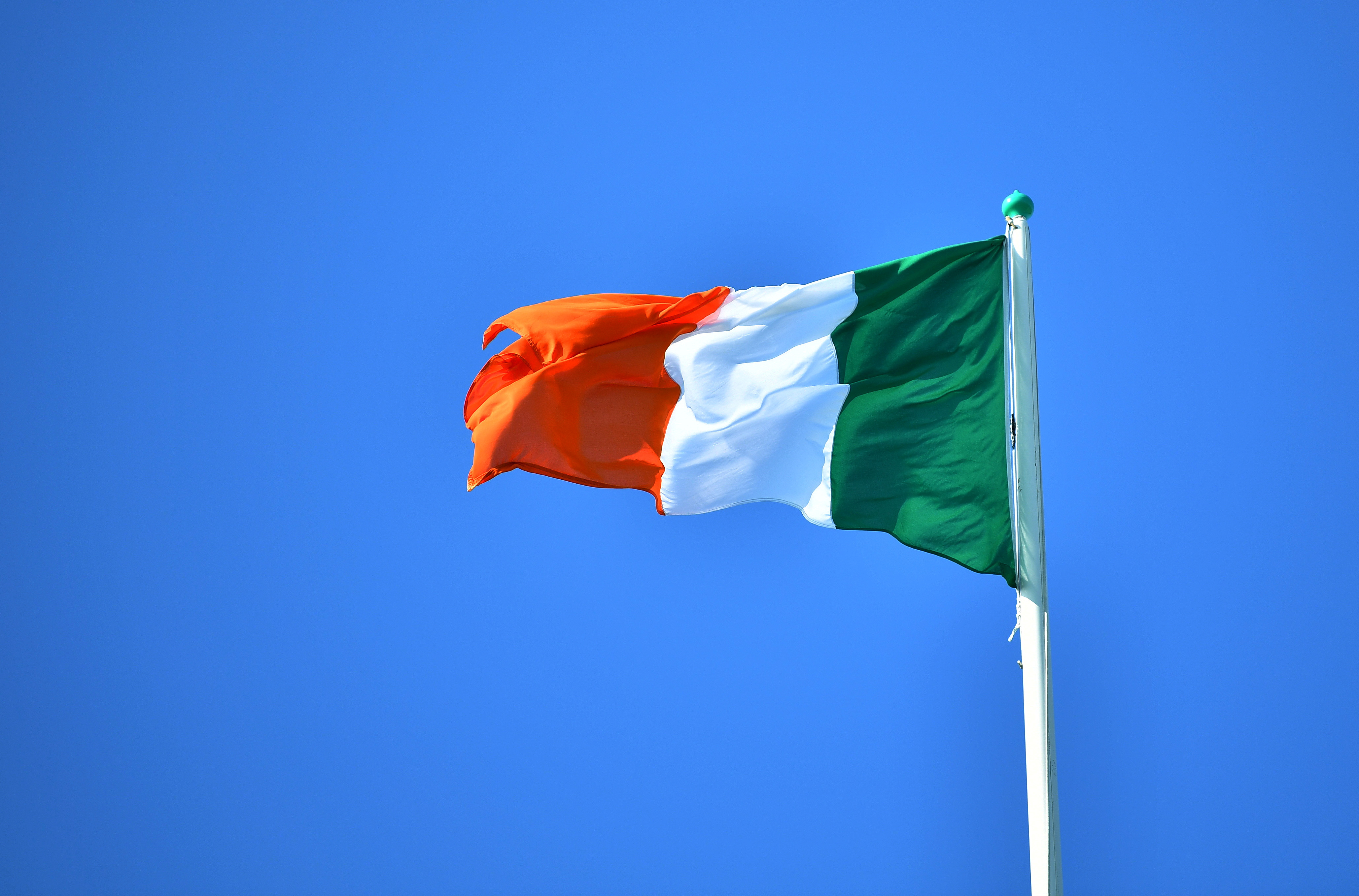 National flag of Ireland flies above the President's residence, ahead of the arrival of Pope Francis, in Dublin