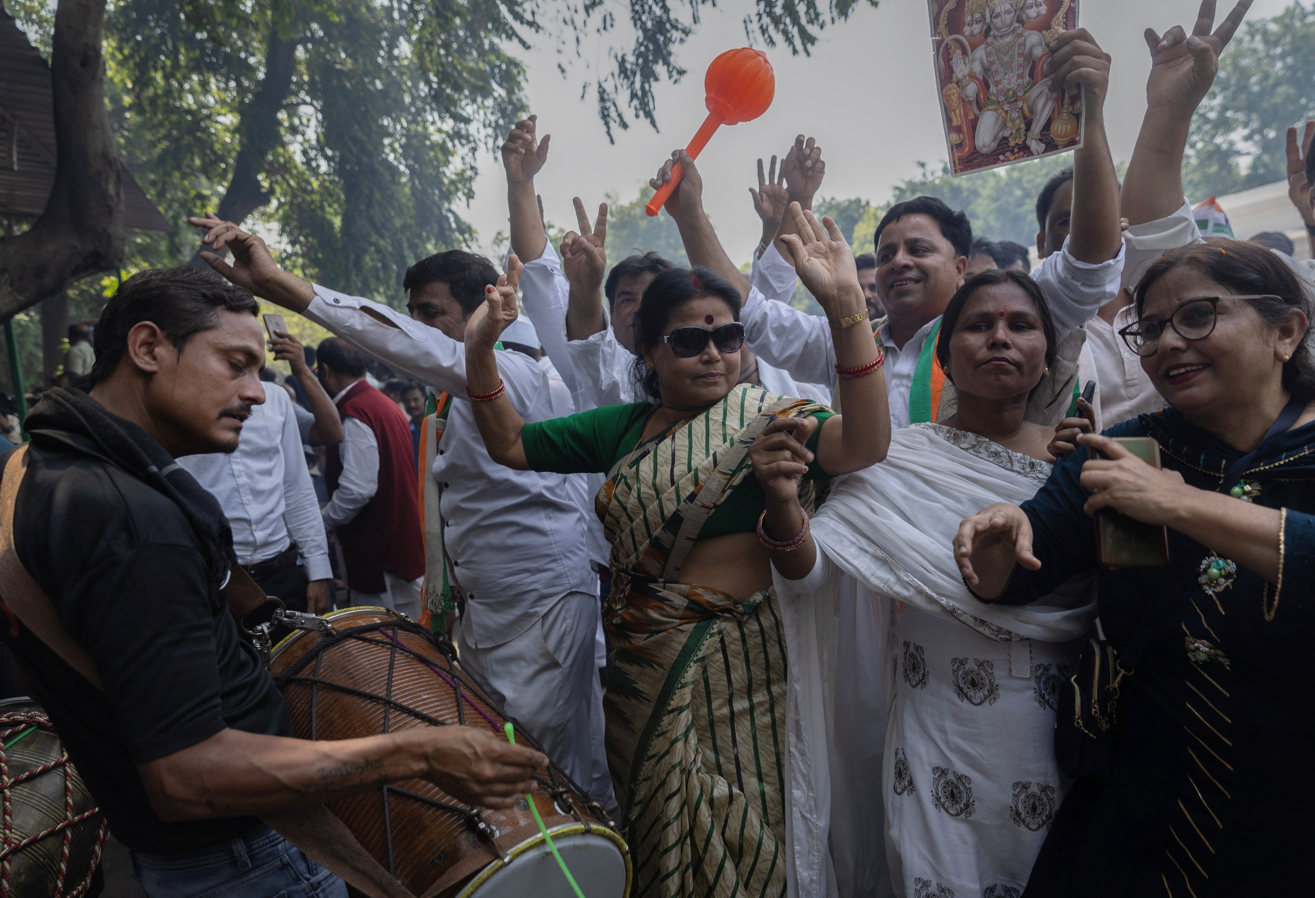 Congress party celebrate after the initial poll results in Karnataka elections at the party headquarters in New Delhi