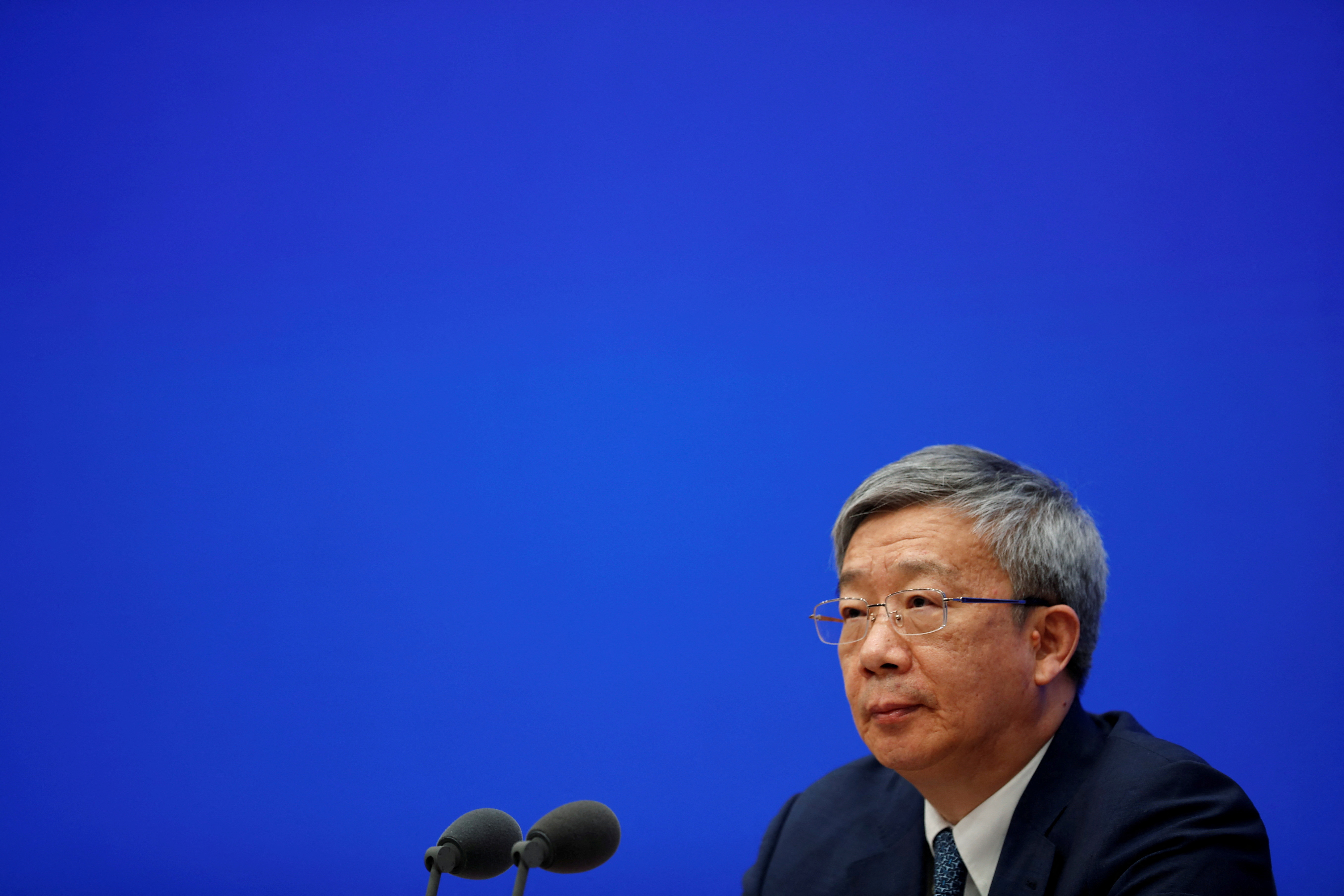 PBOC Governor Yi Gang attends a news conference in Beijing