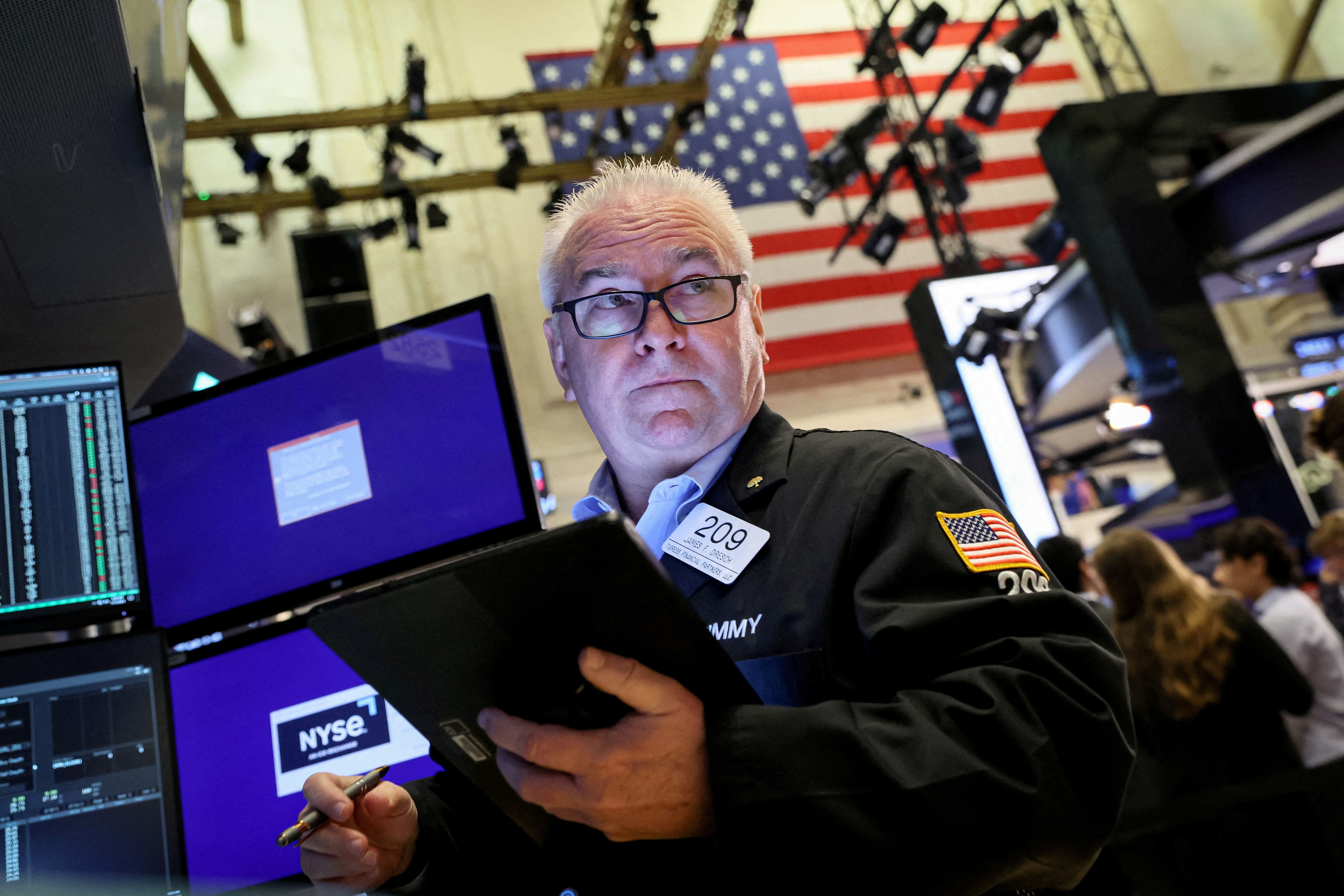 Traders work on the floor of the NYSE in New York