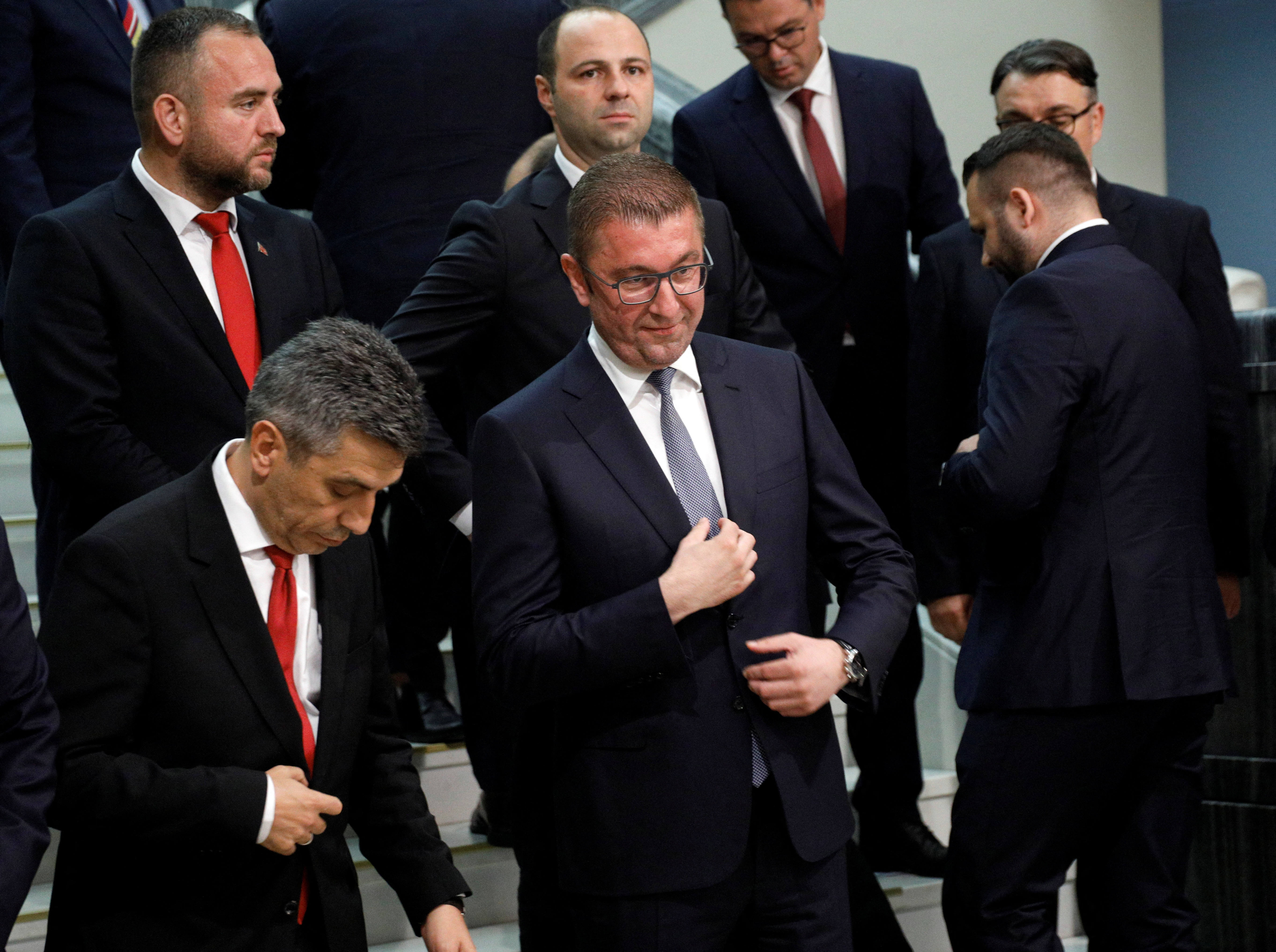 Hristijan Mickoski leader of the ruling VMRO party poses for a picture with newly elected ministers at the Macedonian parliament in Skopje