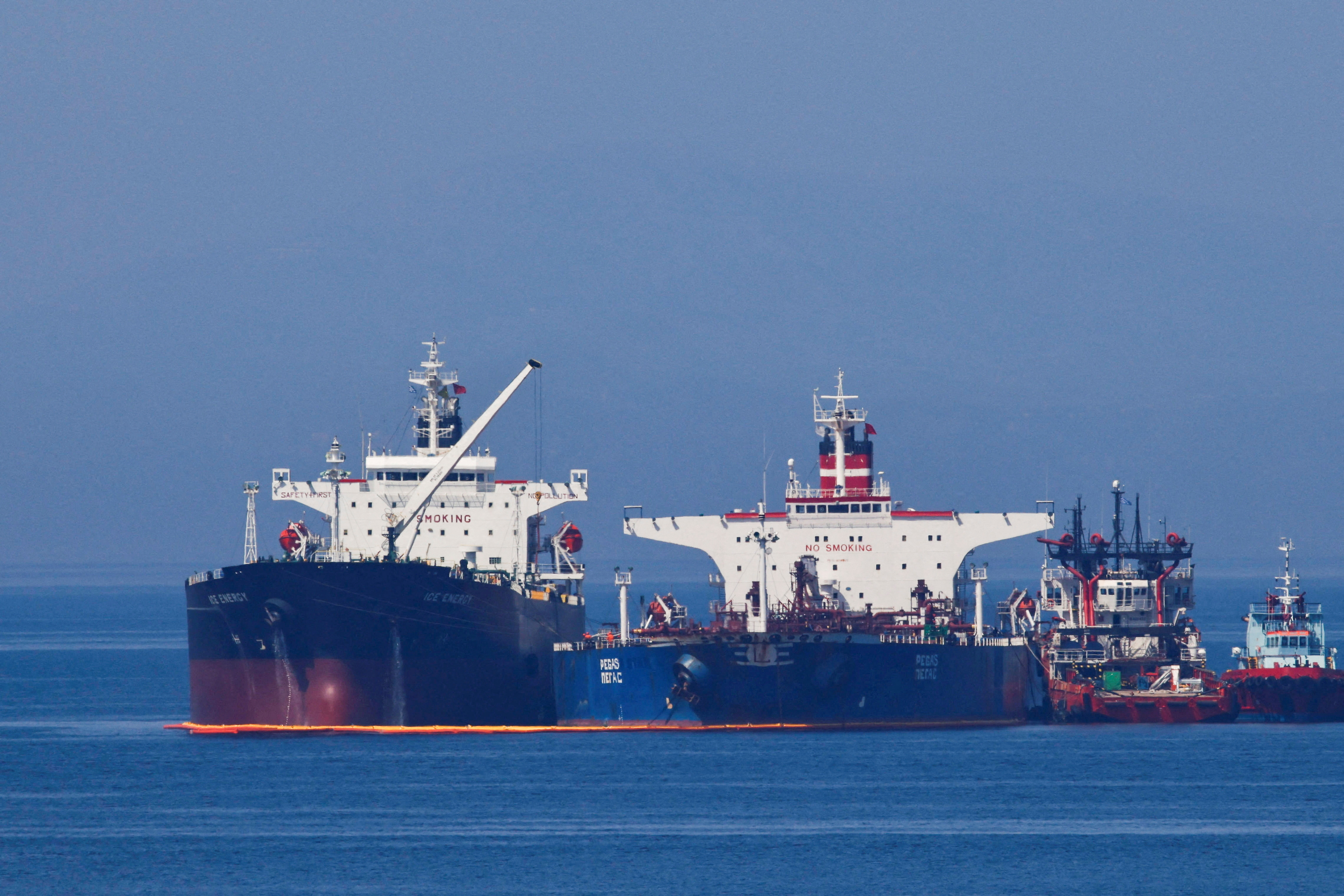 The Liberian-flagged oil tanker Ice Energy transfers crude oil from the Iranian-flagged oil tanker Lana (former Pegas) off the shore of Karystos