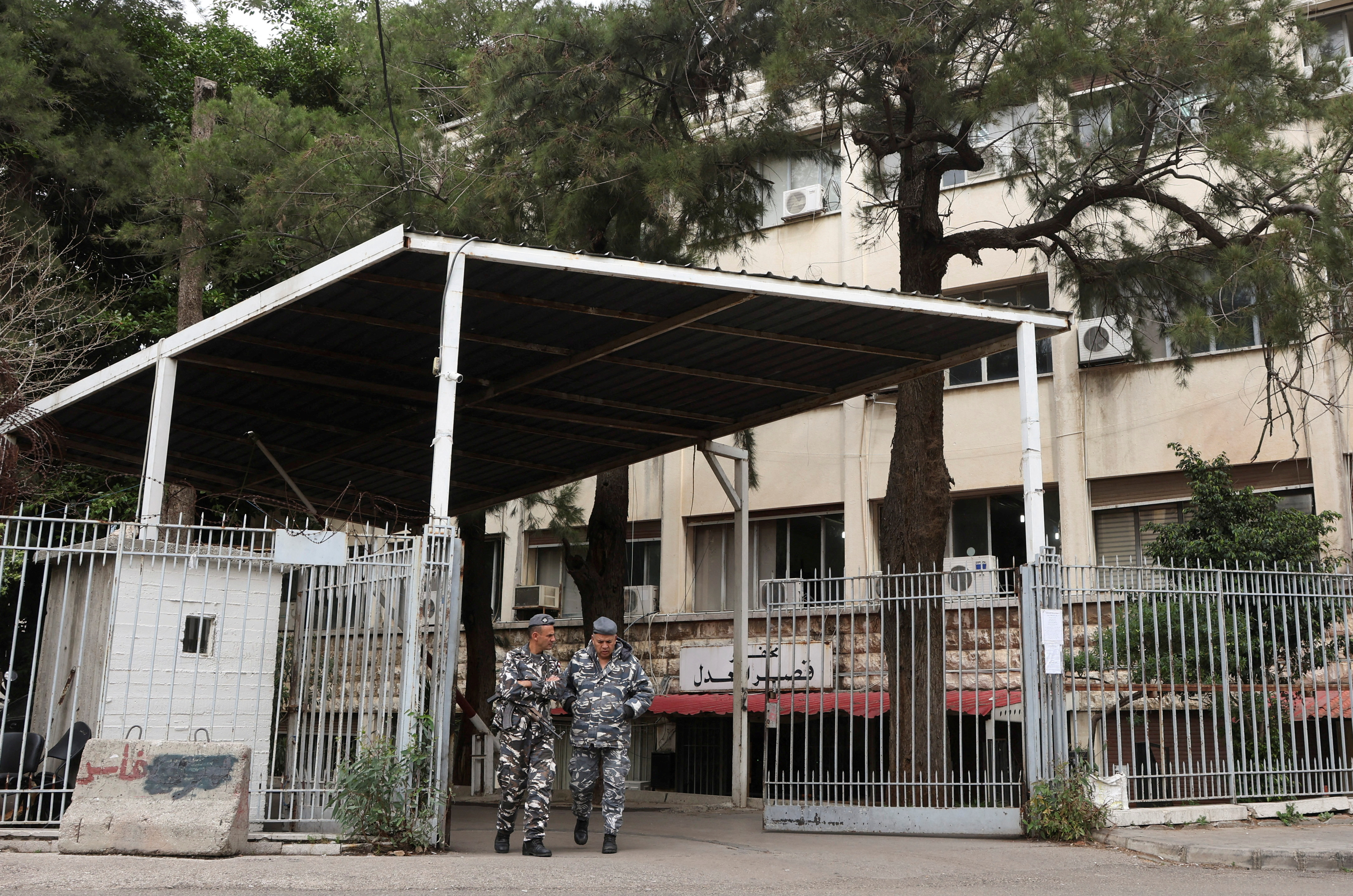 Lebanese police stand outside the Justice Palace as Lebanon's central bank governor Riad Salameh attends a court hearing
