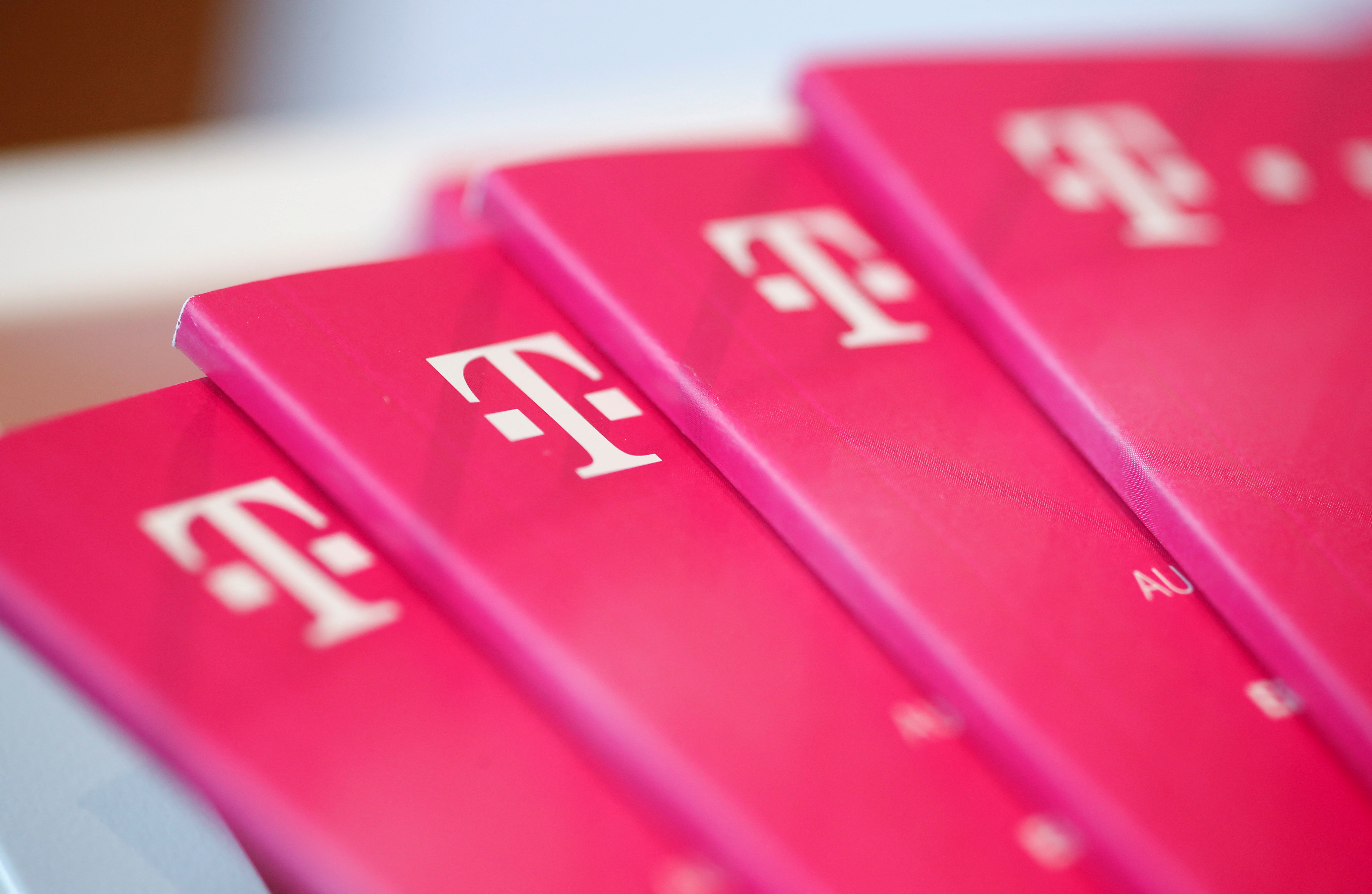 Brochures with the logo of Deutsche Telekom AG are pictured at the shop in the headquarters of German telecommunications giant in Bonn