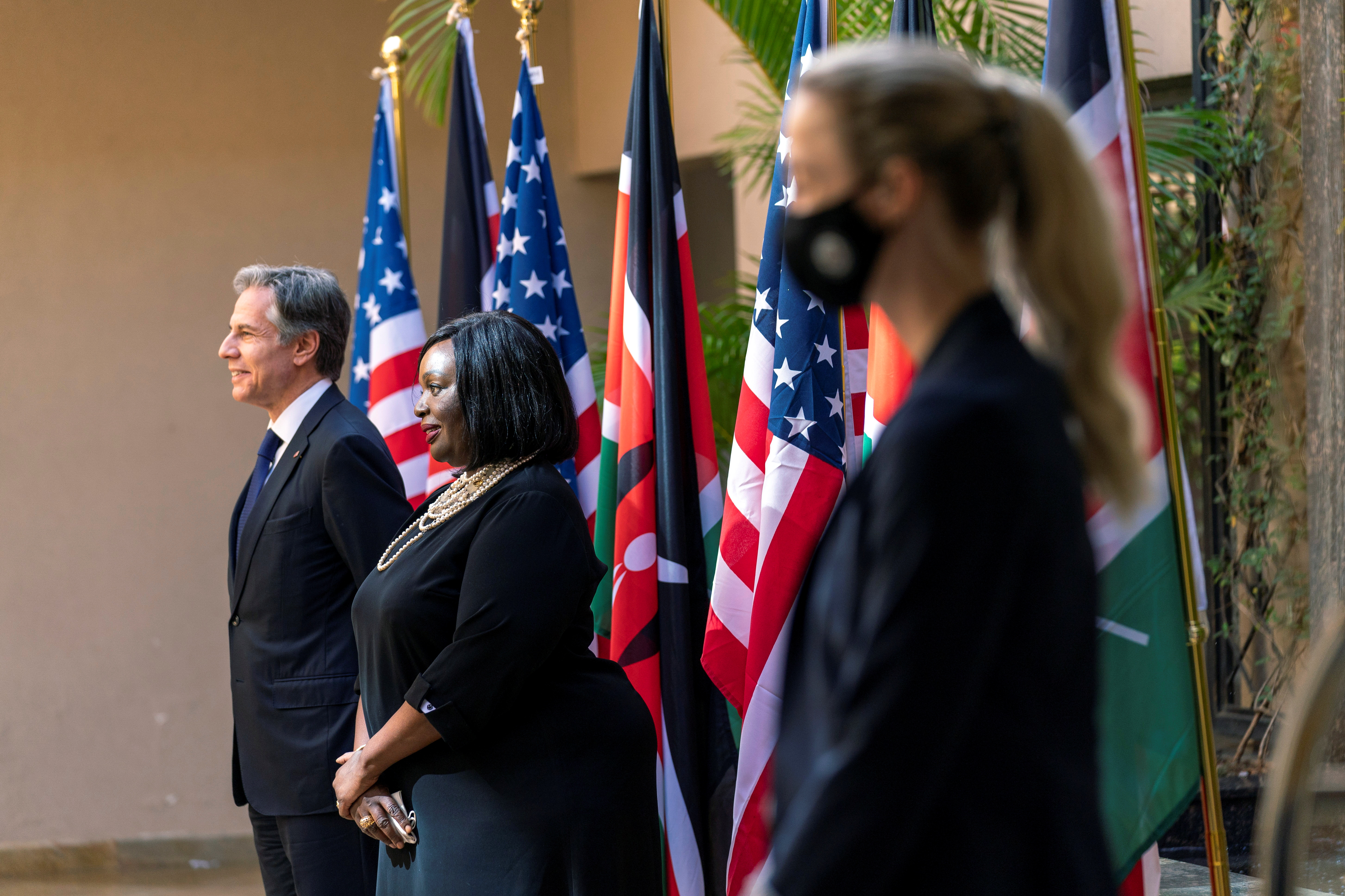 U.S Secretary of State Antony Blinken and Kenya's Cabinet Secretary for Foreign Affairs, Ambassador Raychelle Omamo, pose for photographs as they arrive for a news conference at the Serena Hotel in Nairobi, Kenya. November 17, 2021. Andrew Harnik/Pool via REUTERS