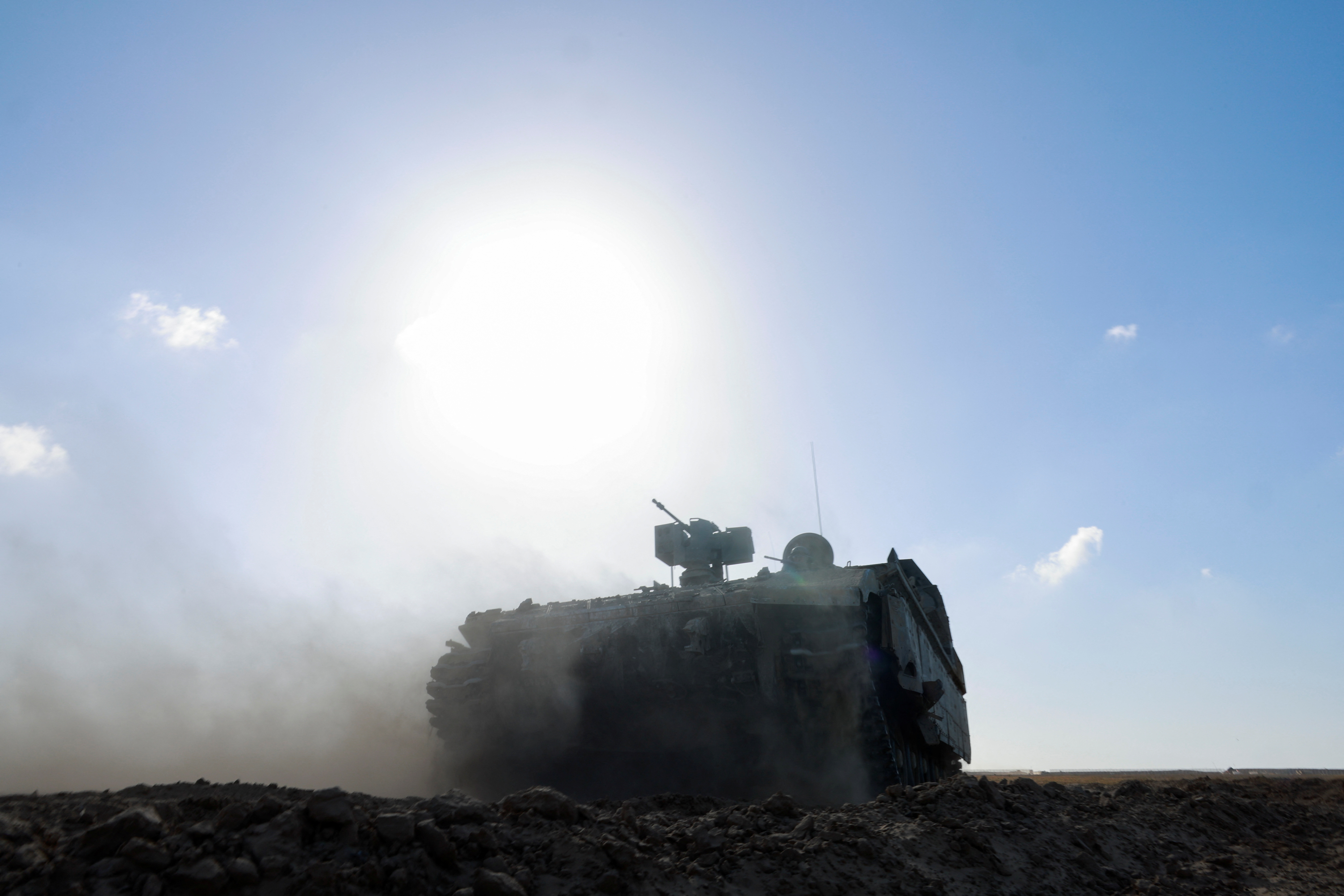 A military vehicle maneuvers near the Israel-Gaza border, in Israel