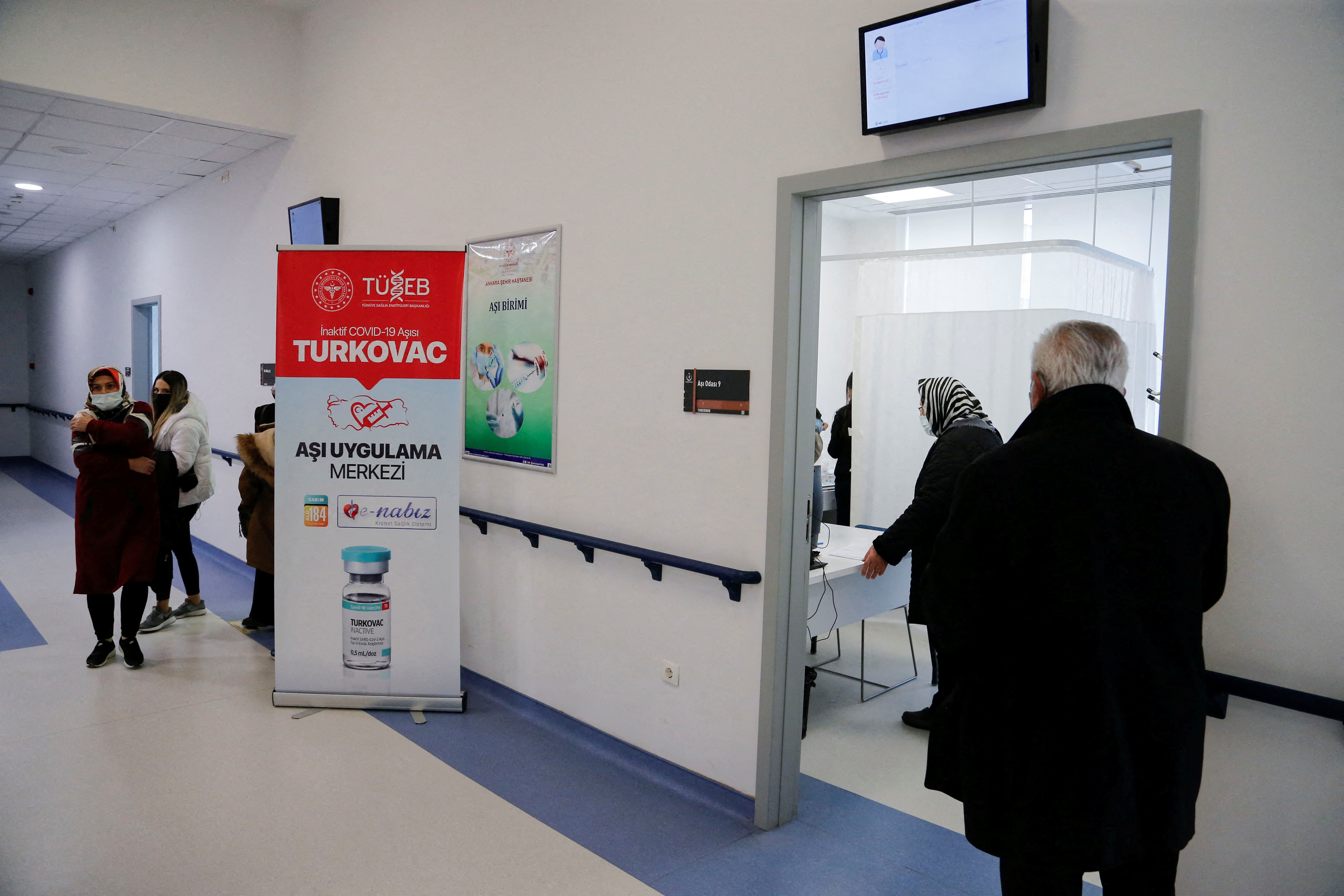 People wait to receive a dose of Turkey's domestically-produced Turkovac coronavirus disease (COVID-19) vaccine in Ankara
