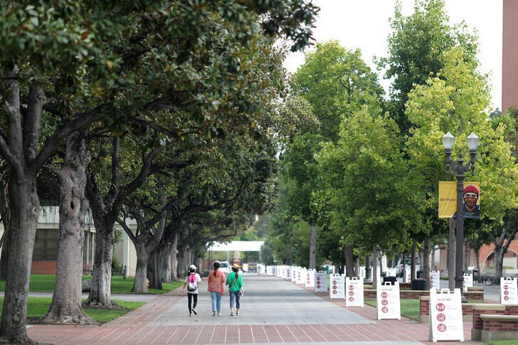 People walk on an empty USC campus, amid the outbreak of the coronavirus disease (COVID-19), in Los Angeles