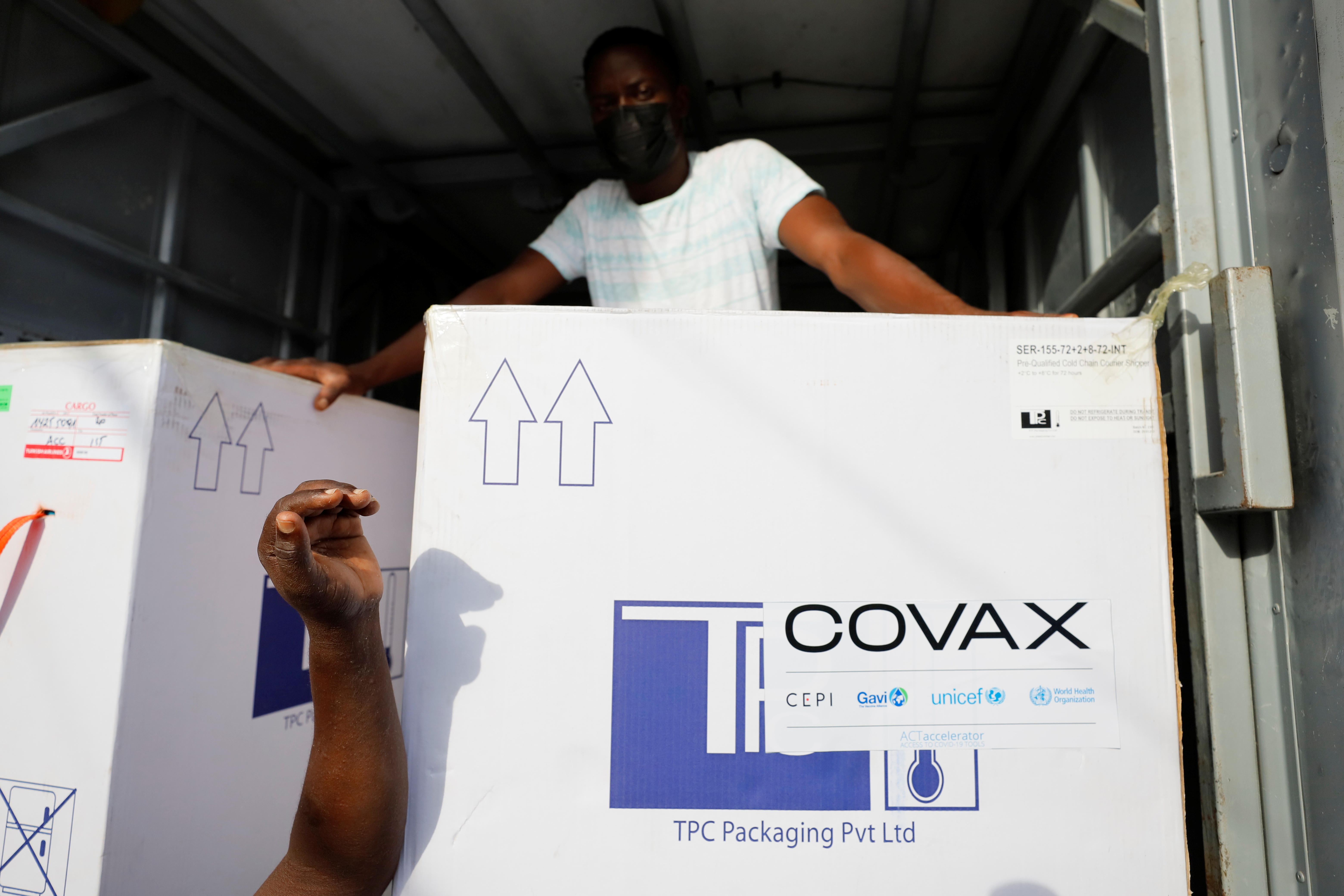 Boxes of Oxford/AstraZeneca coronavirus disease (COVID-19) vaccines, redeployed from the Democratic Republic of Congo, arrive at a cold storage facility in Accra, Ghana, May 7, 2021. REUTERS/Francis Kokoroko