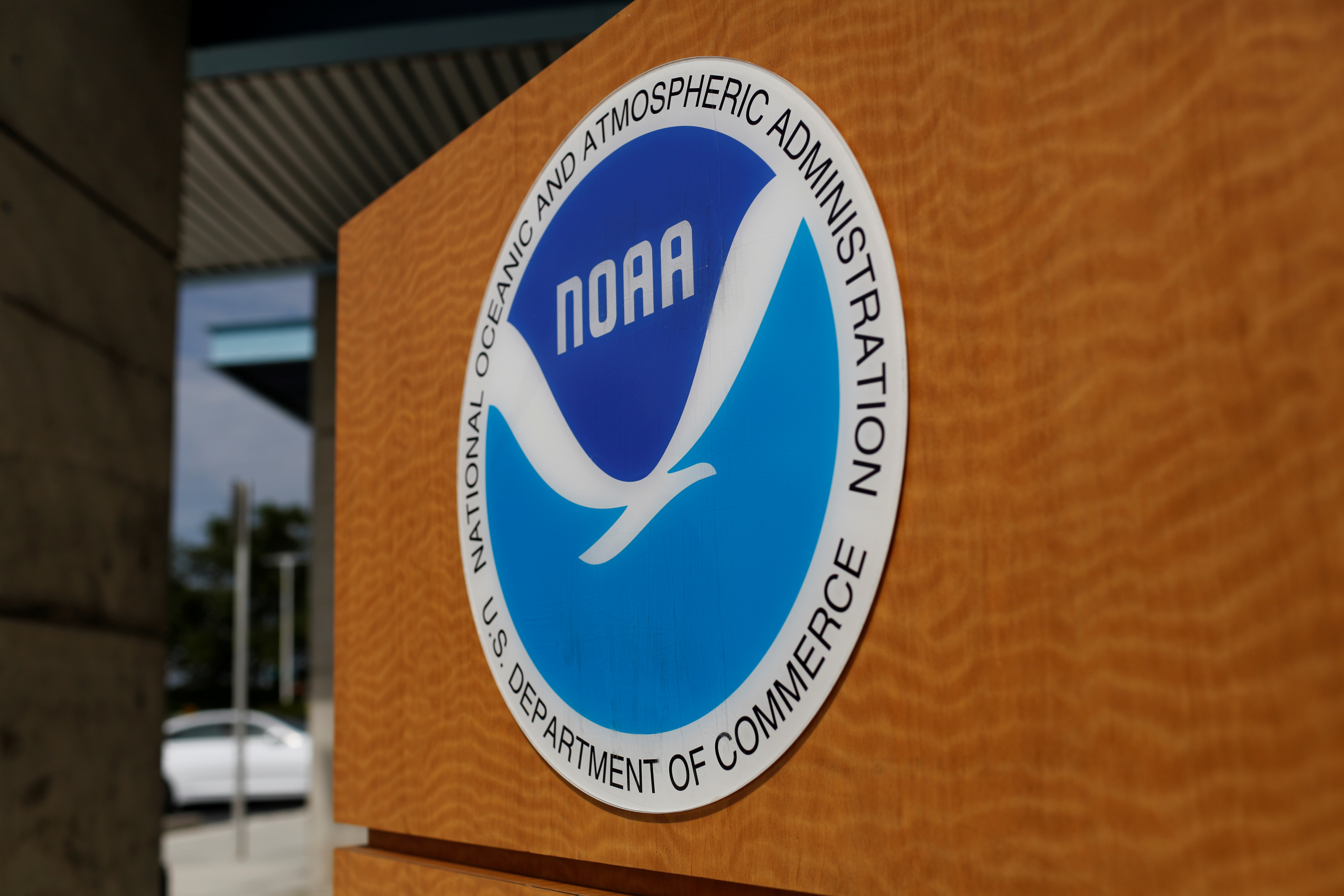 The logo of the National Oceanic and Atmospheric Administration is seen at the National Hurricane Center in Miami
