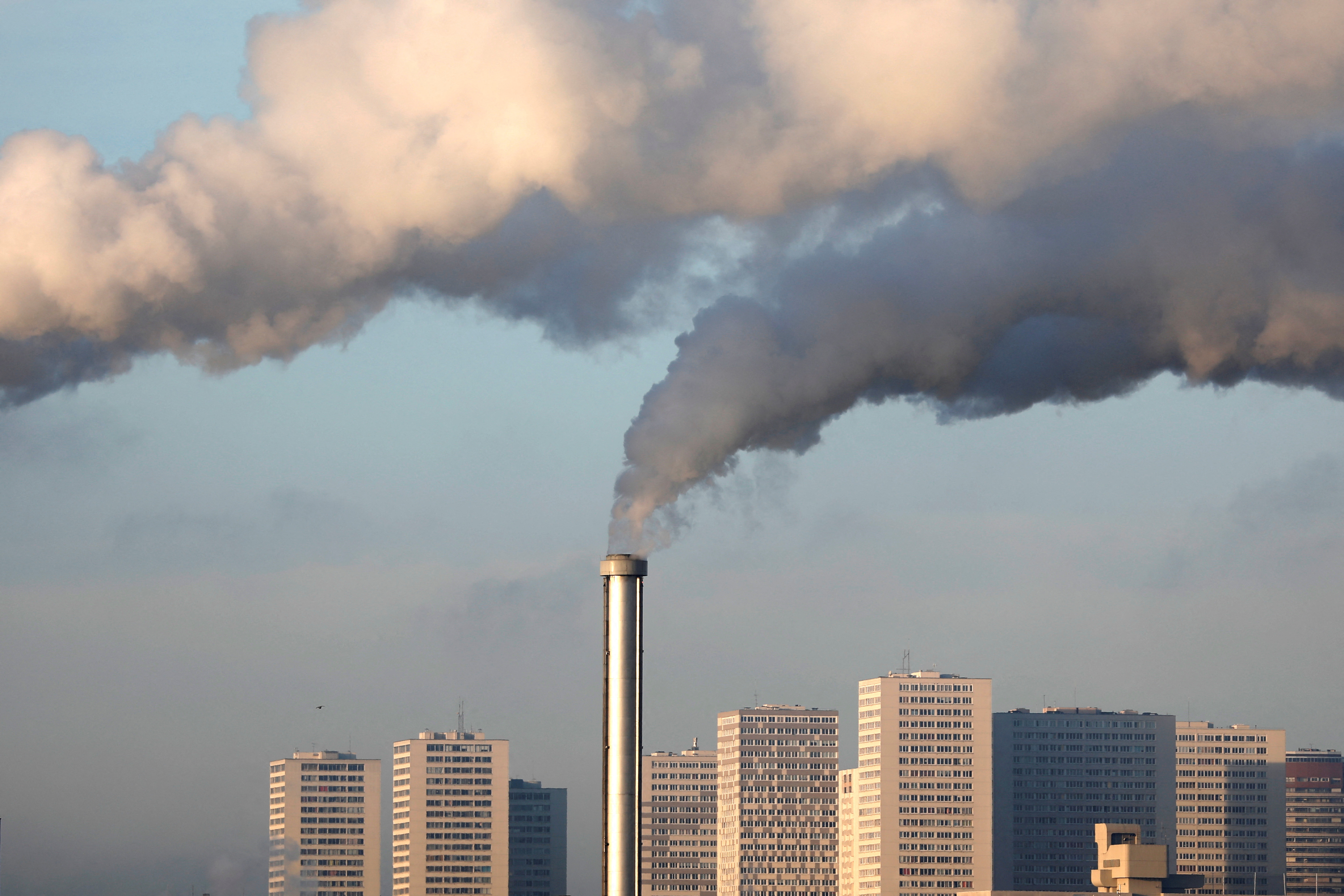 Water vapor billows from smokestacks at the incineration plant of Ivry-sur-Seine, near Paris