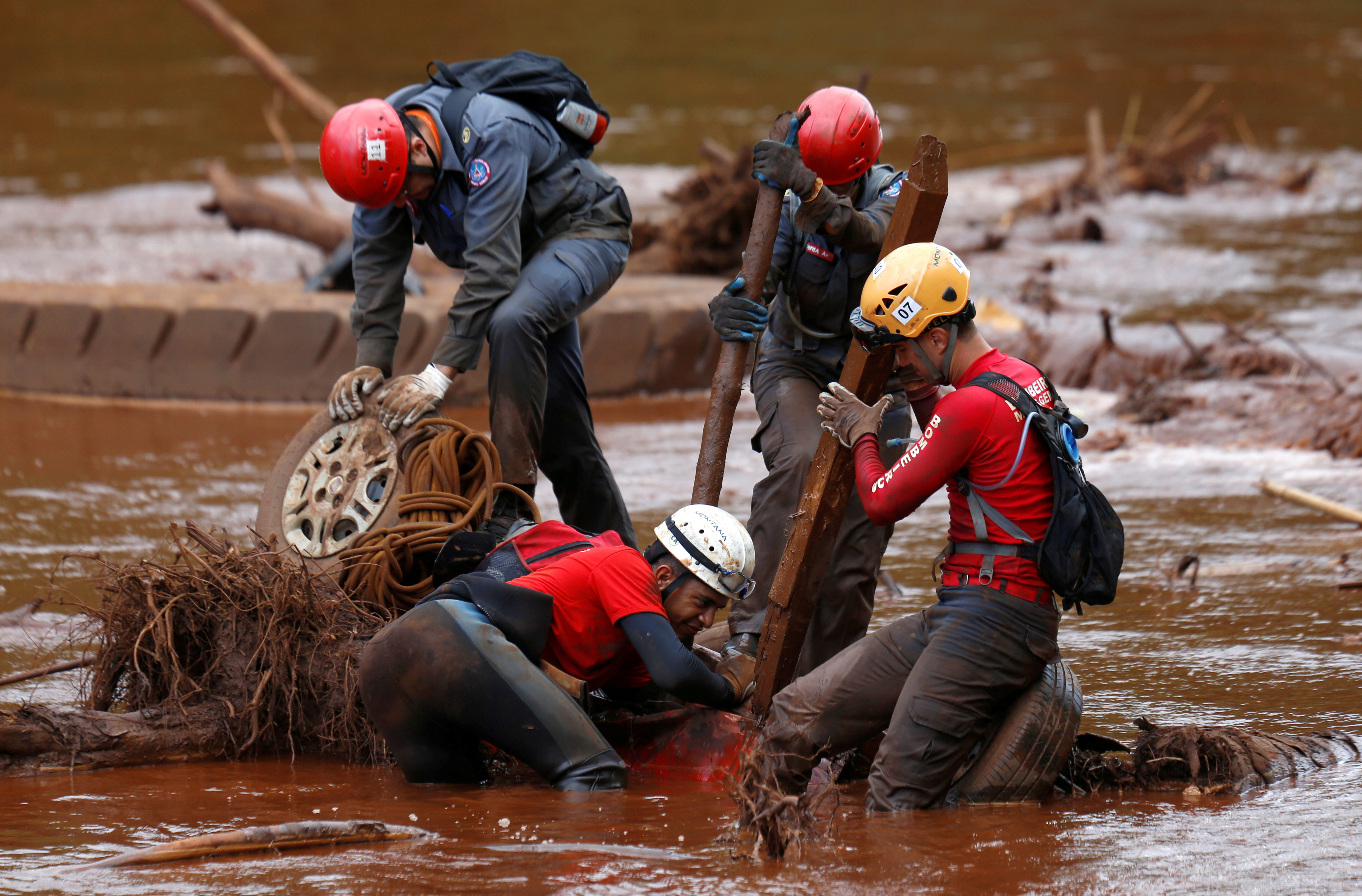 Members of a rescue team search for victims of a collapsed tailings dam owned by Brazilian mining company Vale SA in a vehicle on Paraopeba River, in Brumadinho