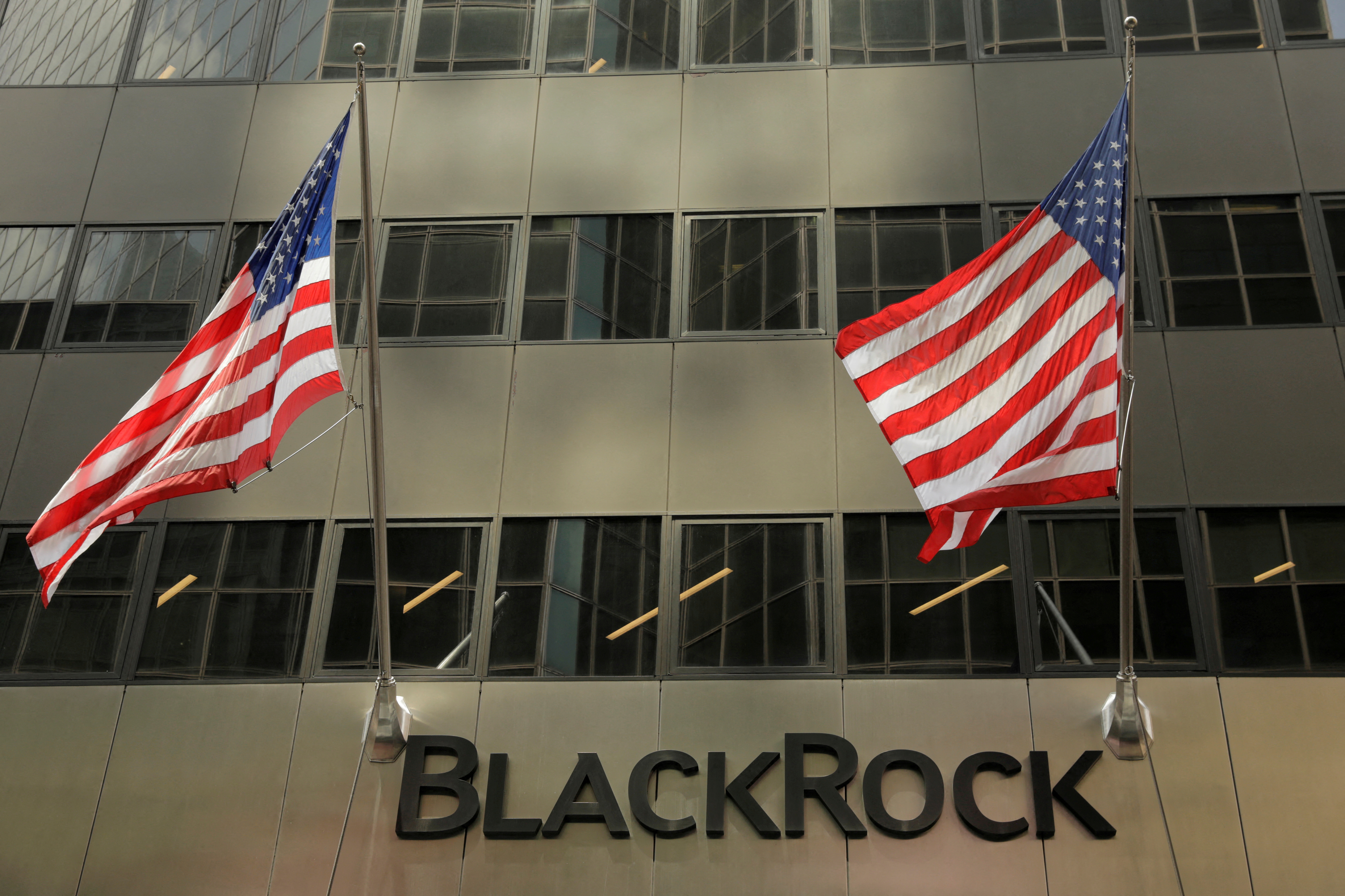 A sign for BlackRock Inc hangs above their building in New York U.S., July 16, 2018. REUTERS/Lucas Jackson/File Photo