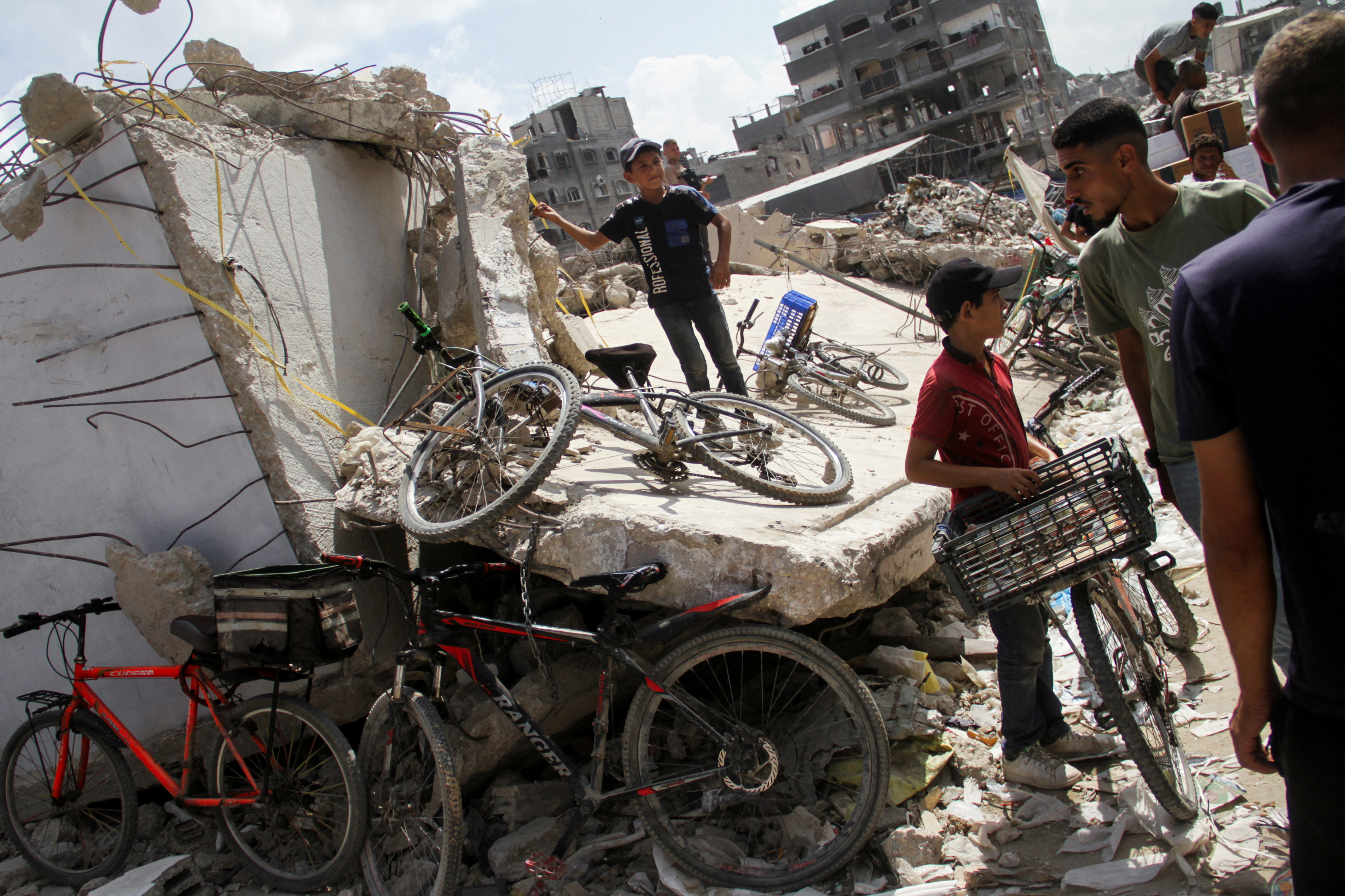 Palestinians gather to receive aid, in Jabalia, northern Gaza Strip