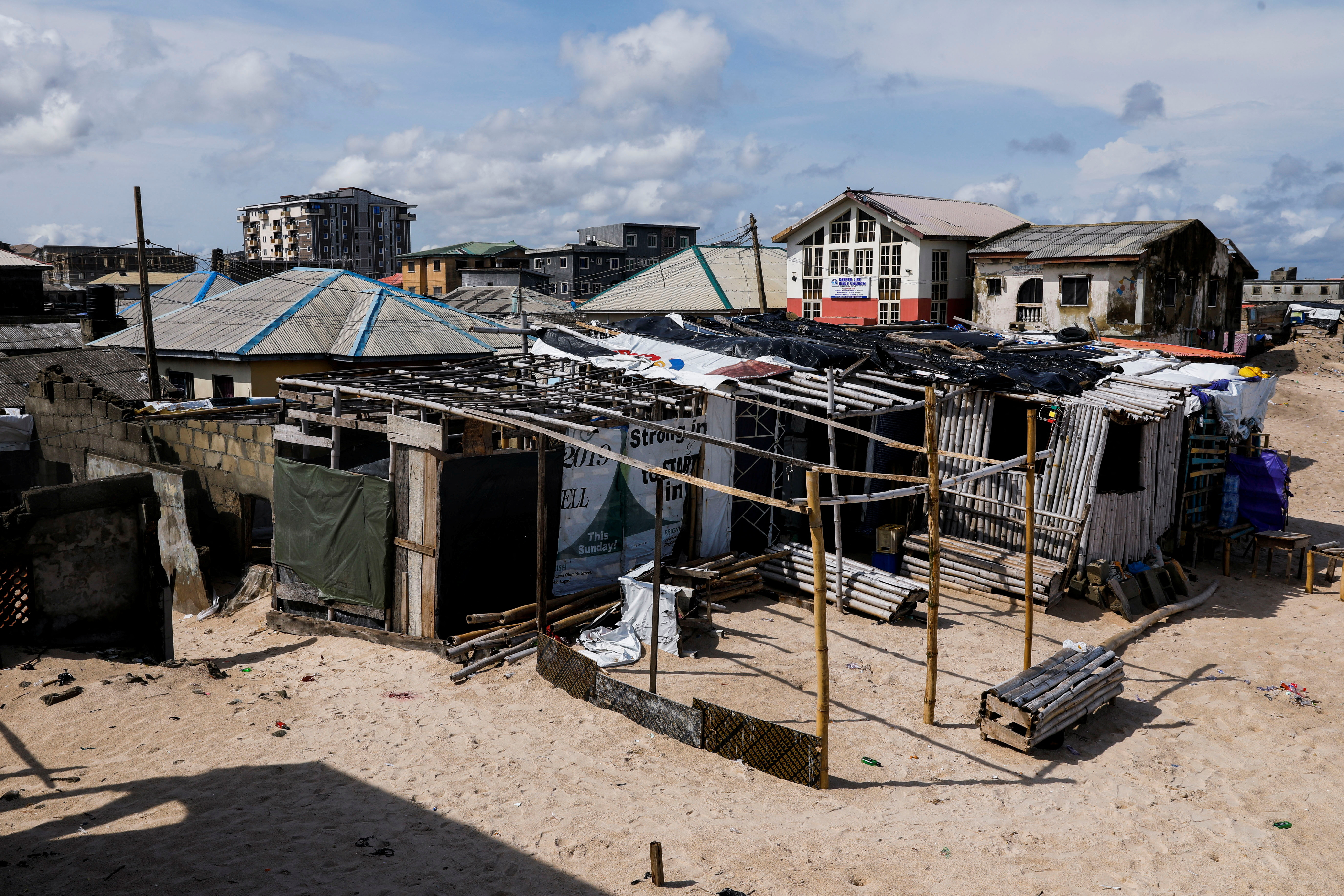 A view of settlements on the shore of the Alpha beach, affected by an ocean surge, in Lagos