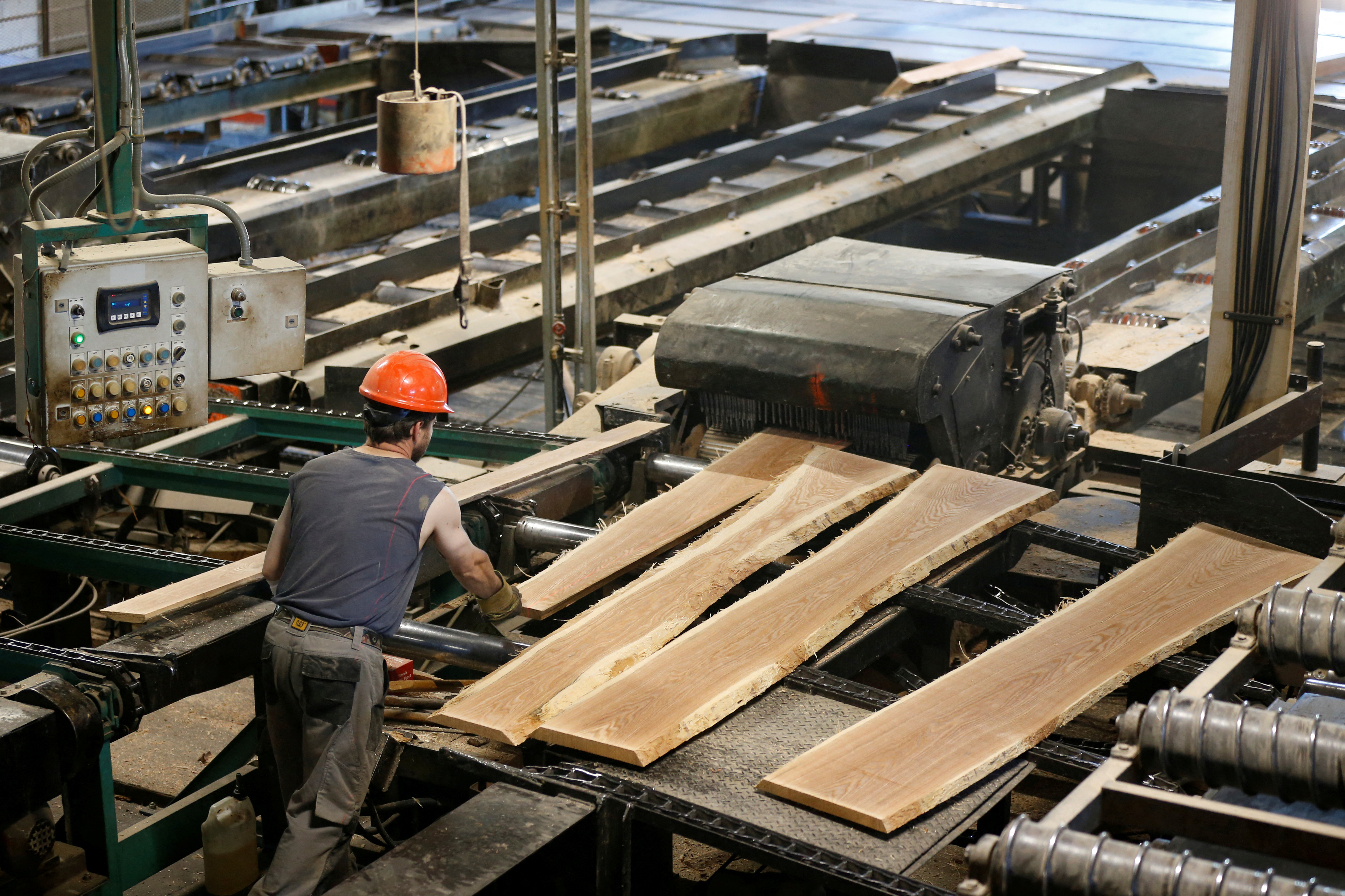 A worker processes lumber in the sawmill at the Murray Brothers Lumber Company in Madawaska