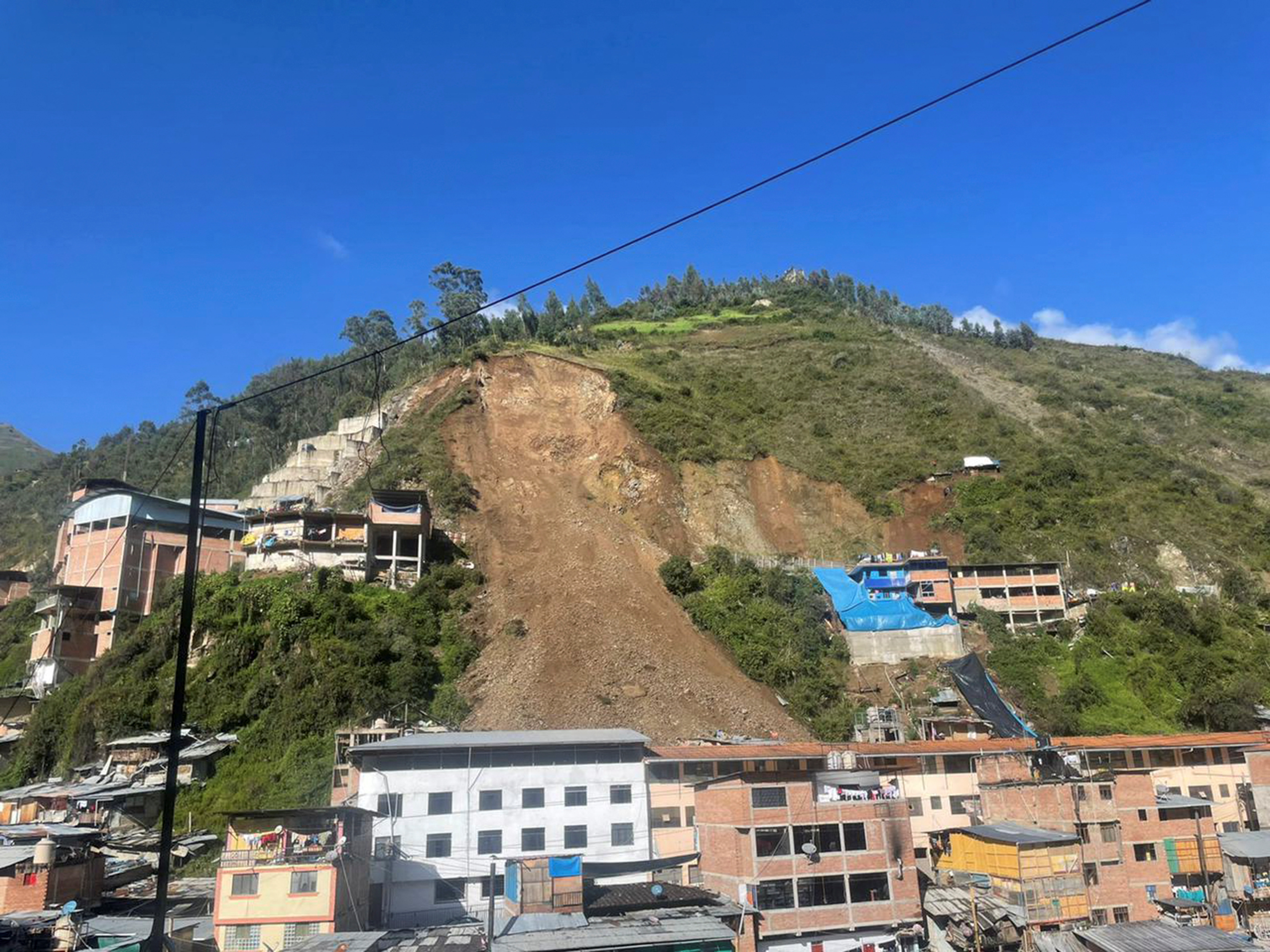 Eight People Rescued, At Least 15 Missing, Nearly 100 Homes Buried After Land in Peru
