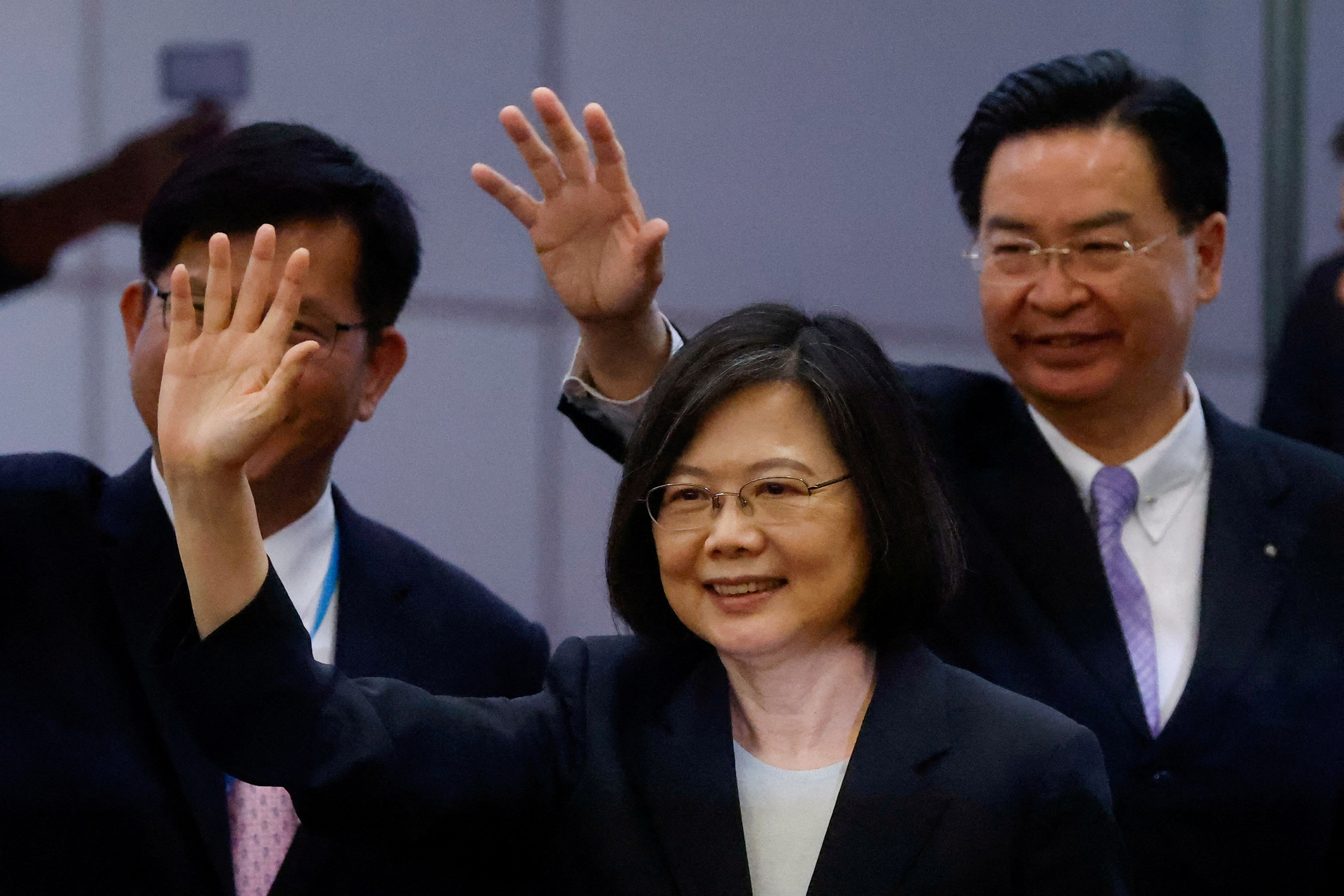 Taiwanese President Tsai Ing-wen waves to the media before her departure to New York to start her trip to Guatemala and Belize