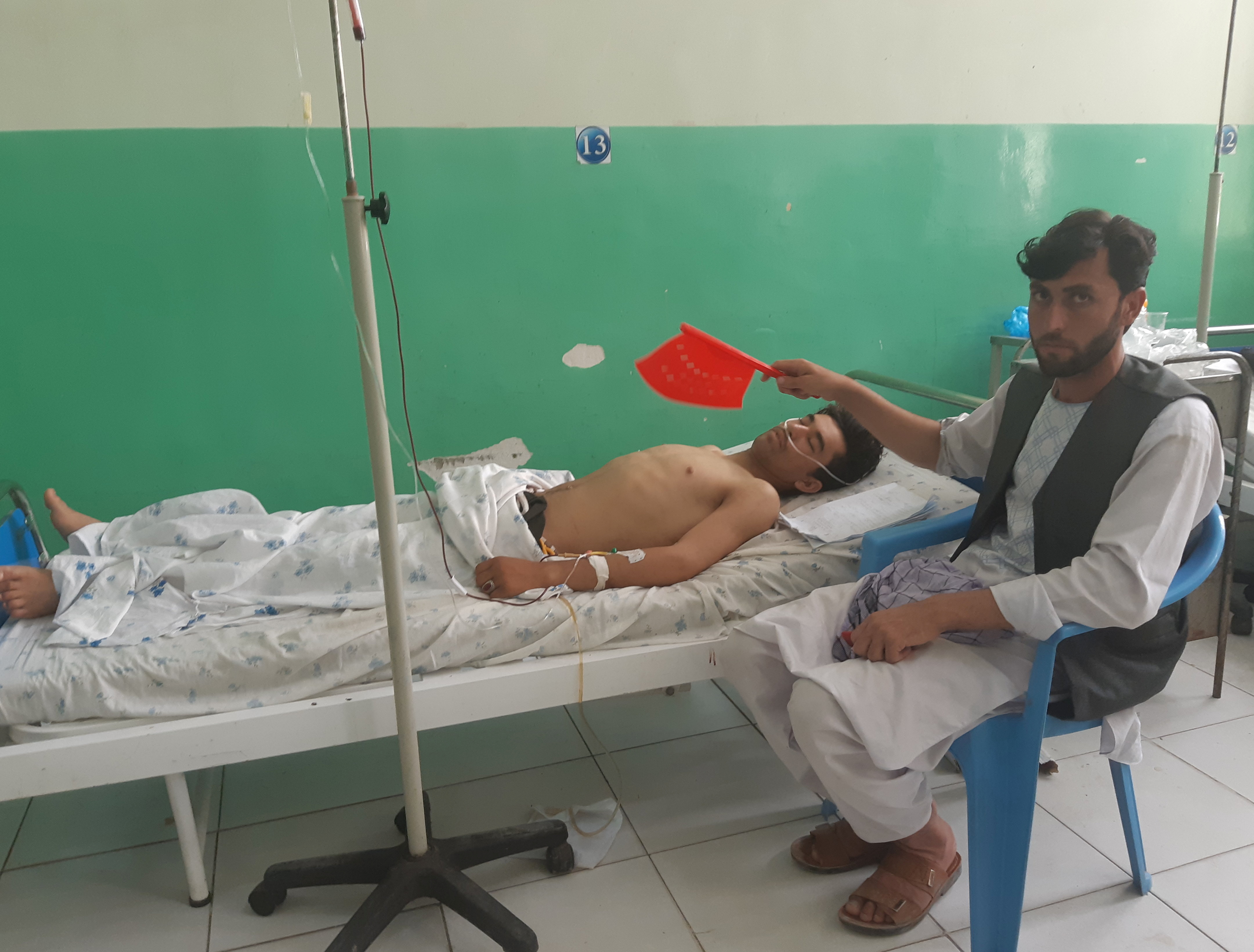 Wounded worker from a de-mining organisation receives treatment at a hospital in Baghlan province
