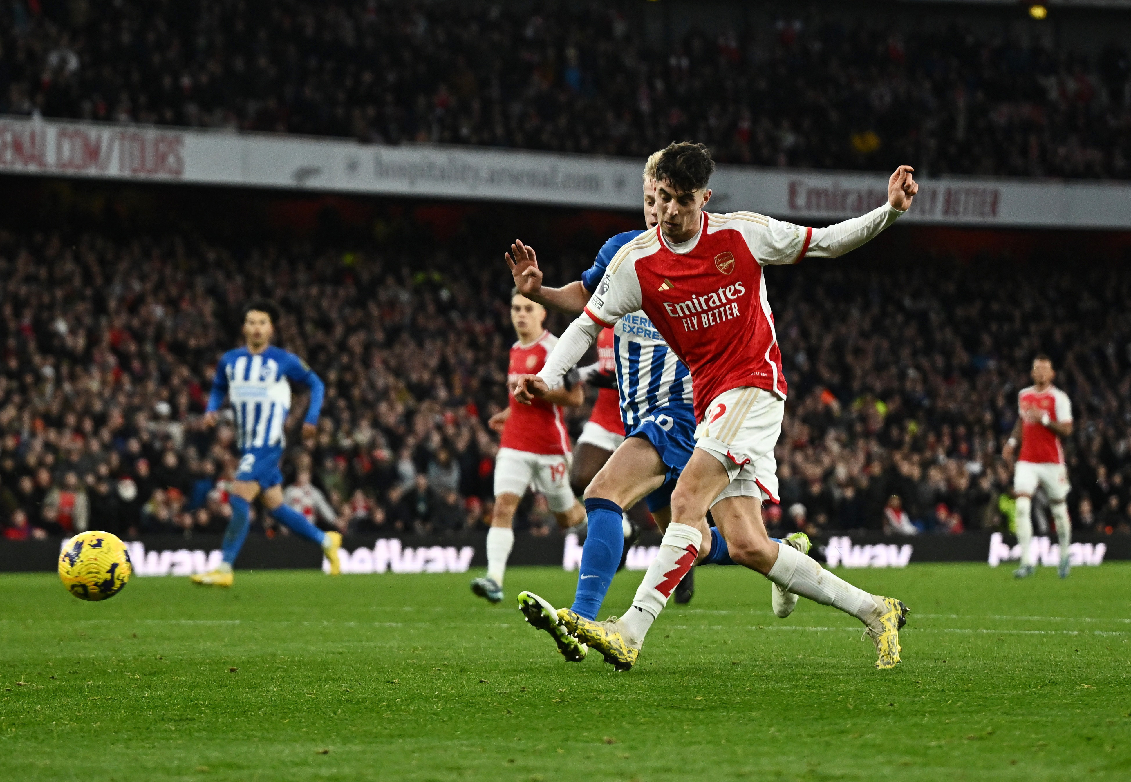 Soccer-Arsenal move top of the league with 2-0 win over Brighton