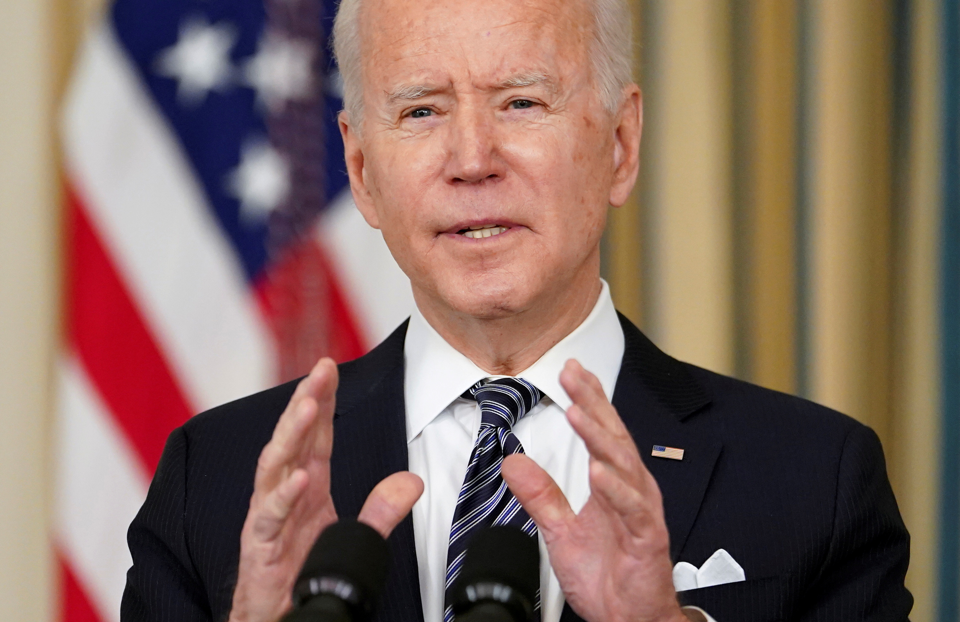 U.S. President Joe Biden speaks about the implementation of the American Rescue Plan in the State Dining Room at the White House in Washington, U.S., March 15, 2021. REUTERS/Kevin Lamarque/File Photo