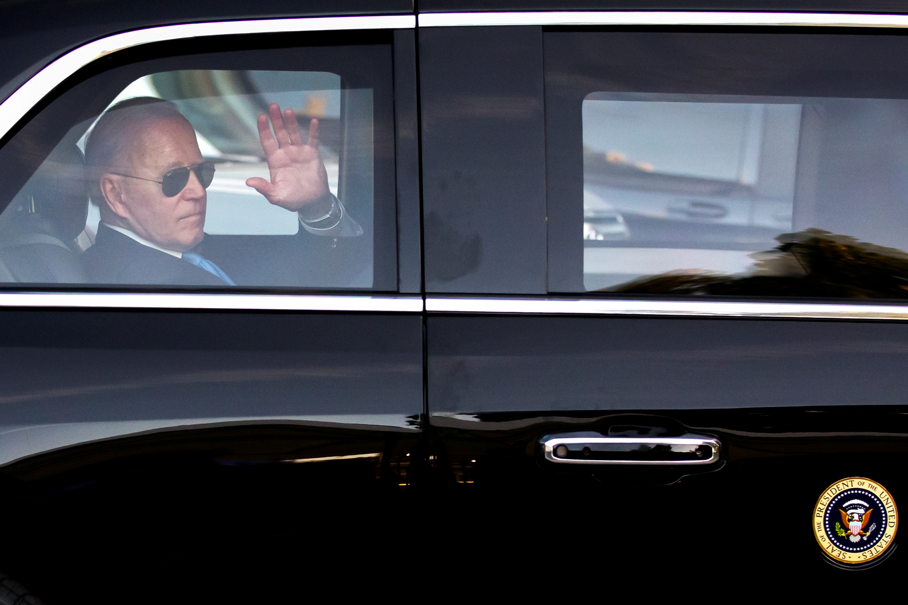 U.S. President Joe Biden waves as he leaves for the airport after his news conference after the U.S.-Russia summit with Russia's President Vladimir Putin, in Geneva, Switzerland, June 16, 2021. Peter Klaunzer/ Pool via REUTERS