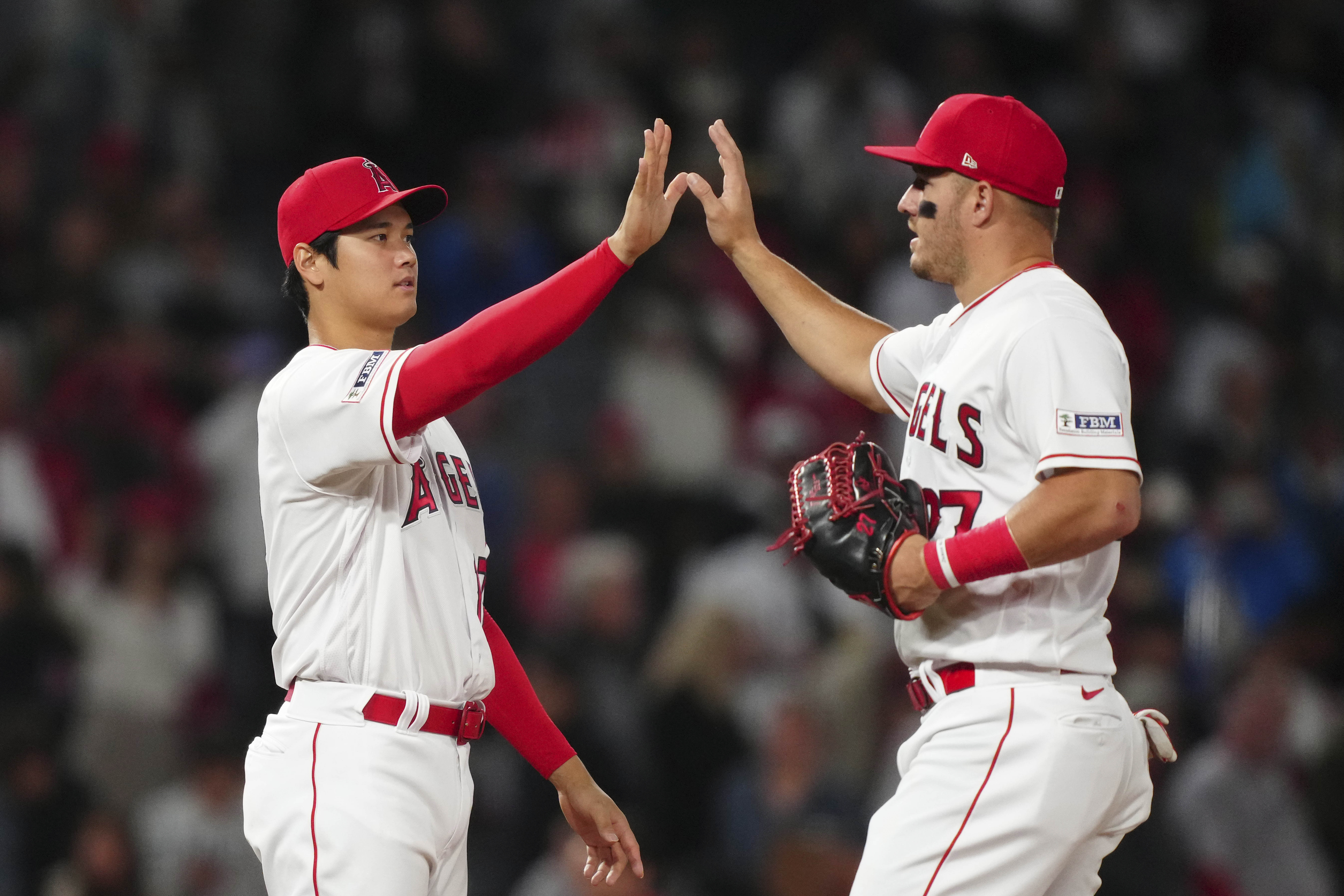 Three homers send Angels to sweep of Red Sox
