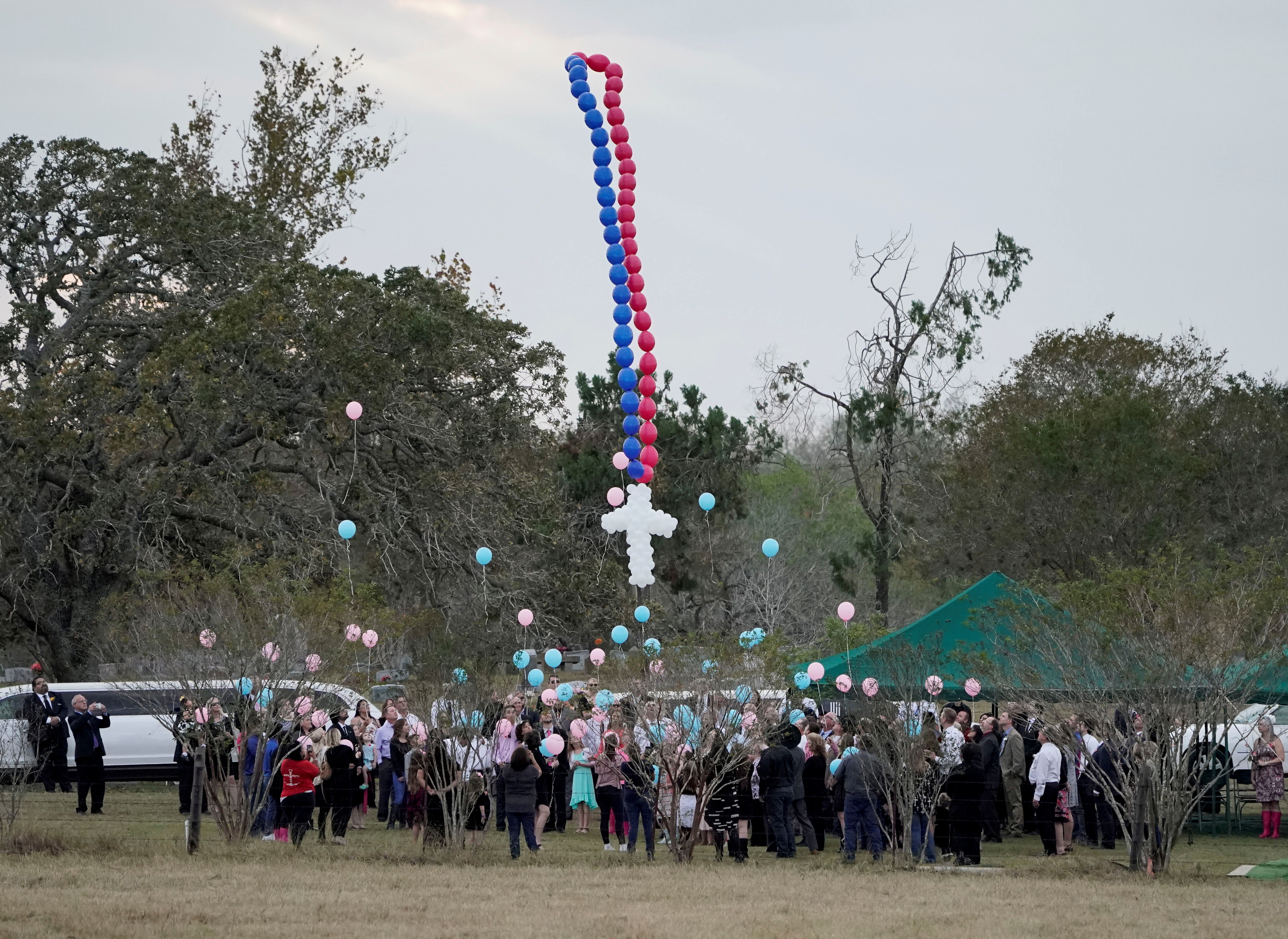 Balloons are released during a funeral for victims of the Sutherland Springs Baptist church shooting