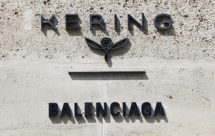 The logos of French luxury group Kering and fashion house Balenciaga