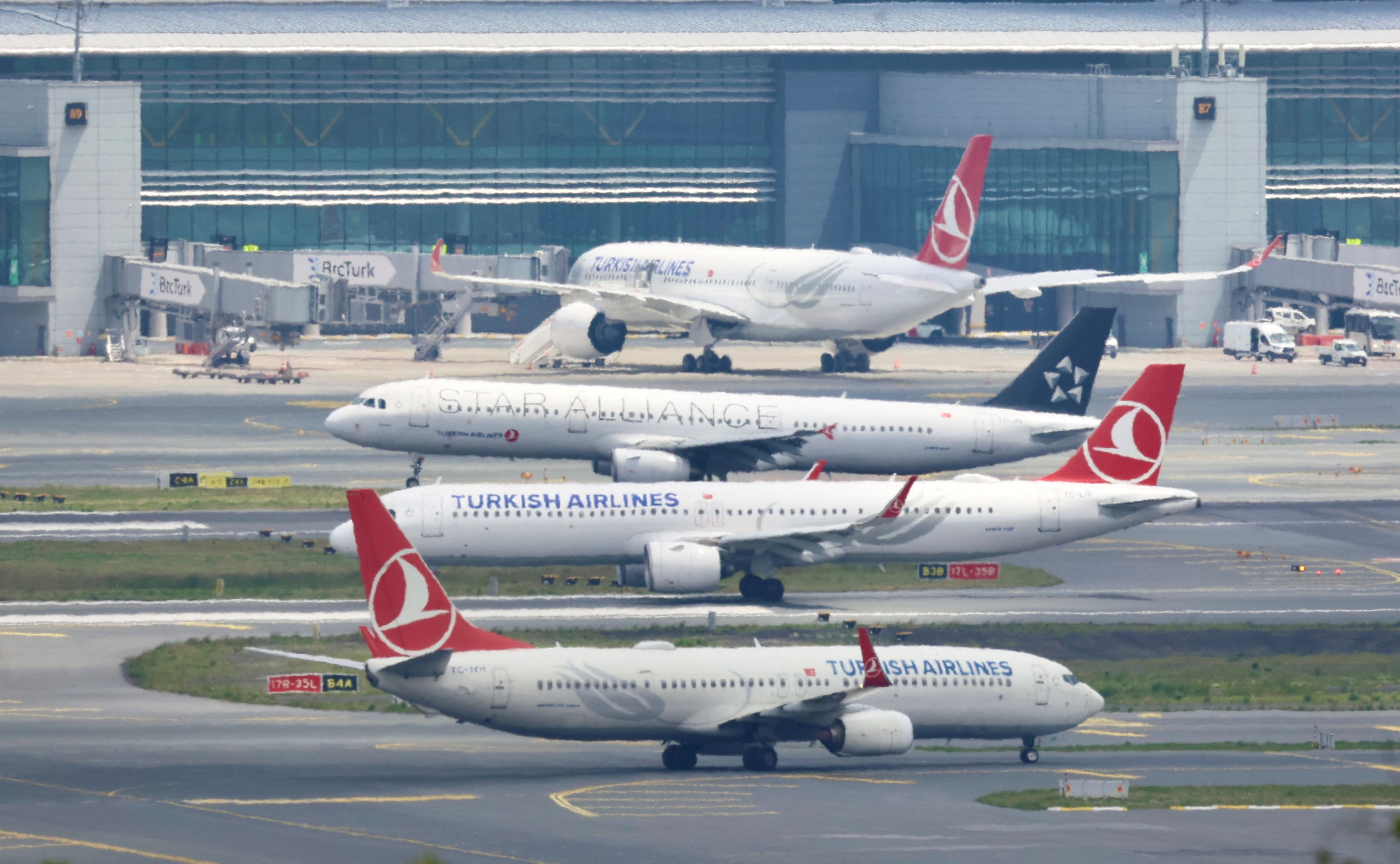 THY aircraft are pictured on the tarmac of IGA in Istanbul
