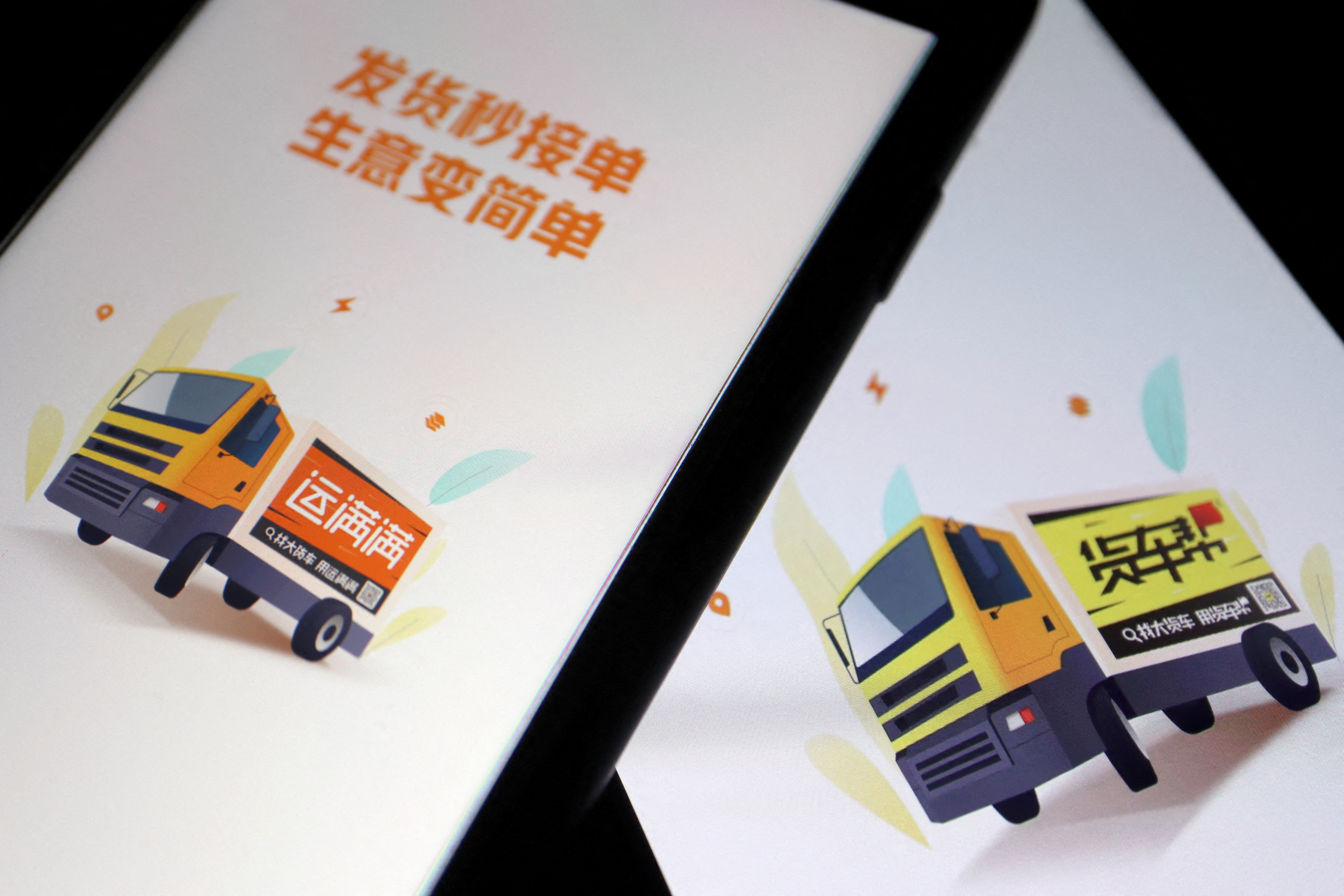 Chinese truck-hailing apps Huochebang and Yunmanman, owned by Full Truck Alliance, are seen on mobile phones in this illustration picture taken July 5, 2021. REUTERS/Florence Lo/Illustration/File Photo