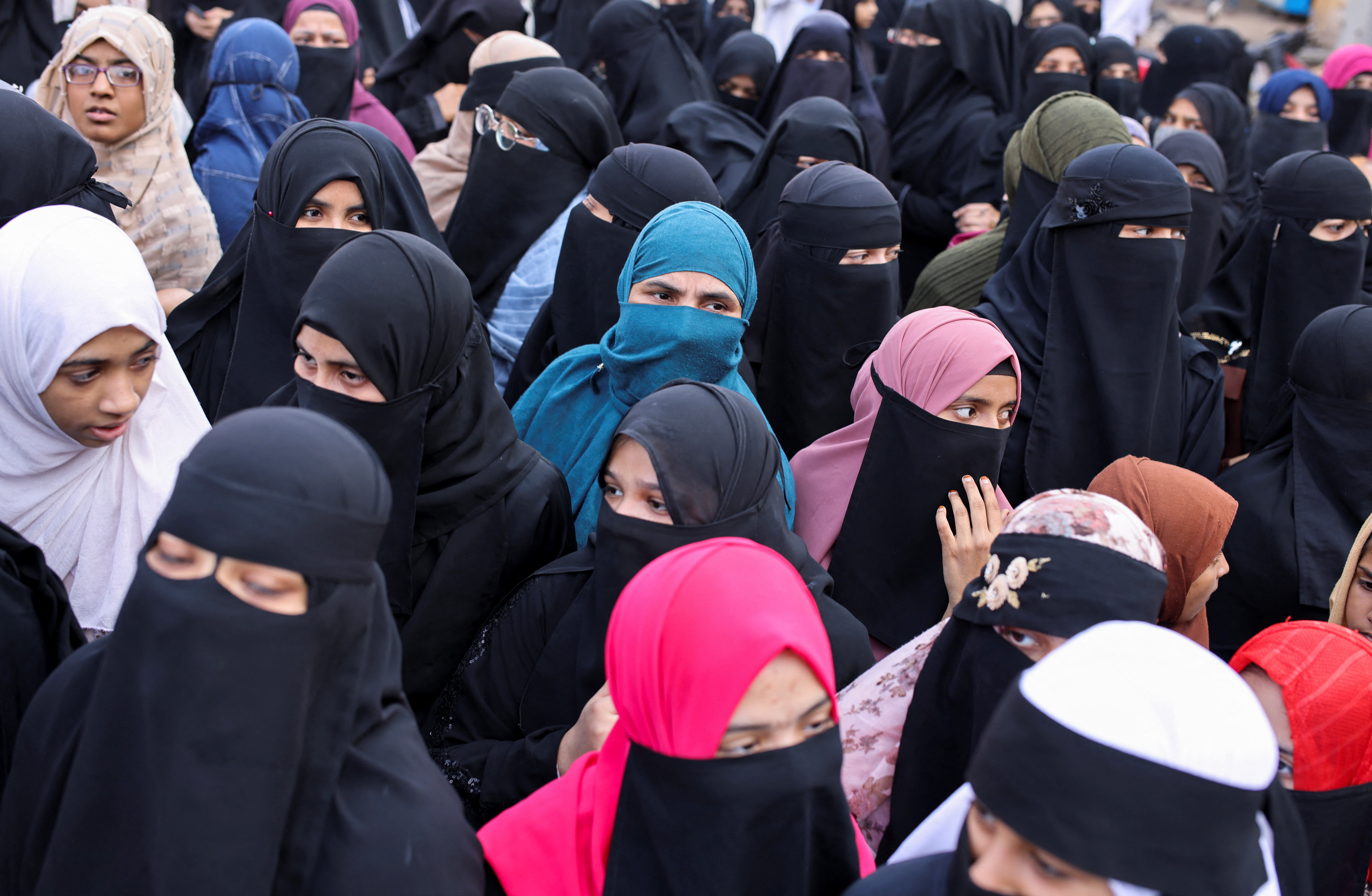 Women wearing hijabs attend a protest against the recent hijab ban in few colleges of Karnataka state