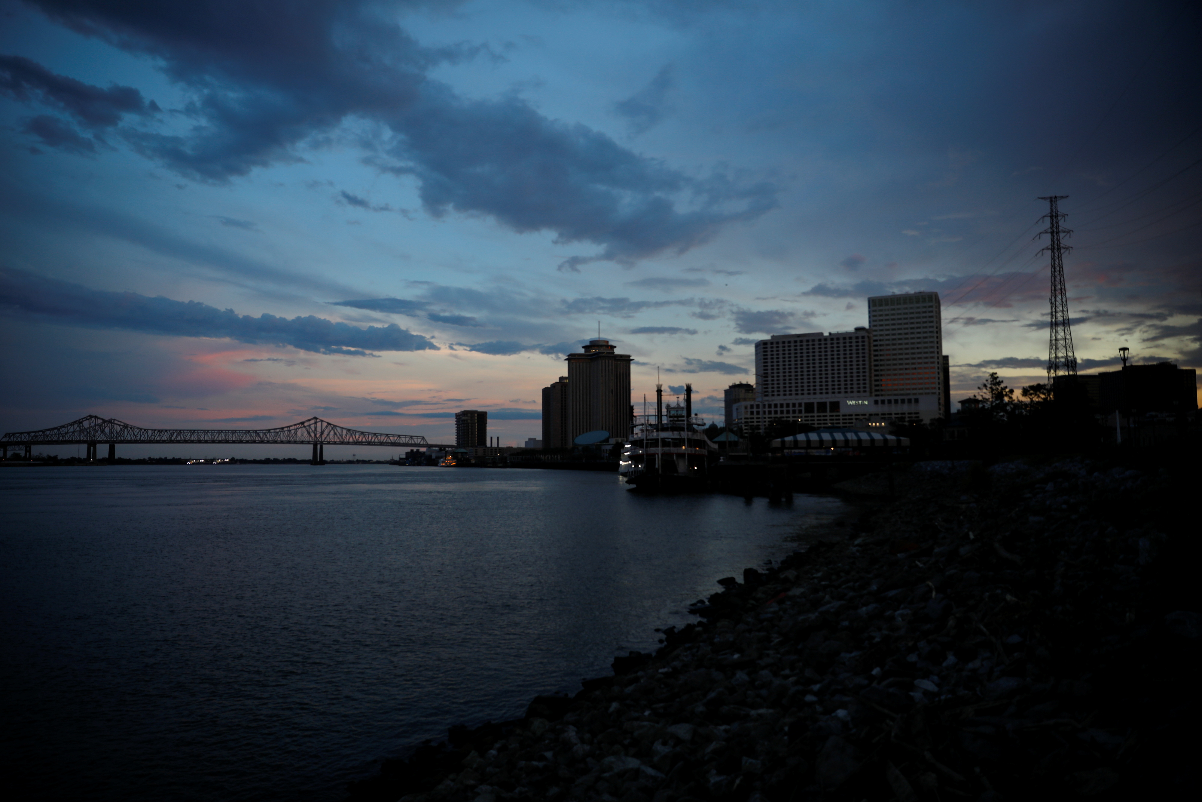 A view of Mississippi River at sunset during a blackout in the city after Hurricane Ida made landfall in Louisiana, in New Orleans, Louisiana, U.S. August 31, 2021. REUTERS/Marco Bello