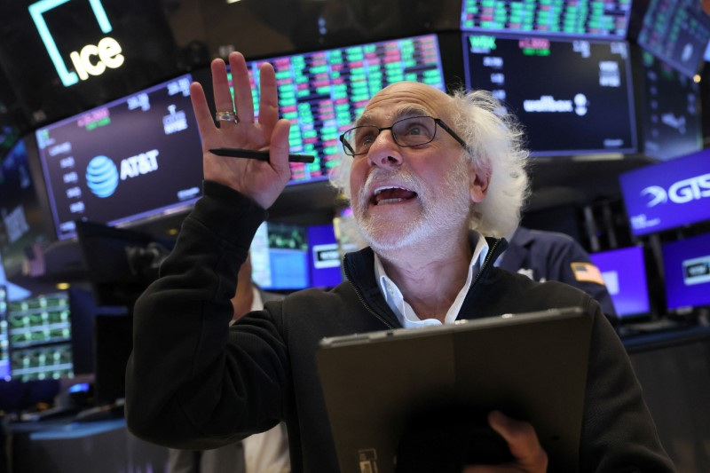 Traders work on the floor of the NYSE in New York