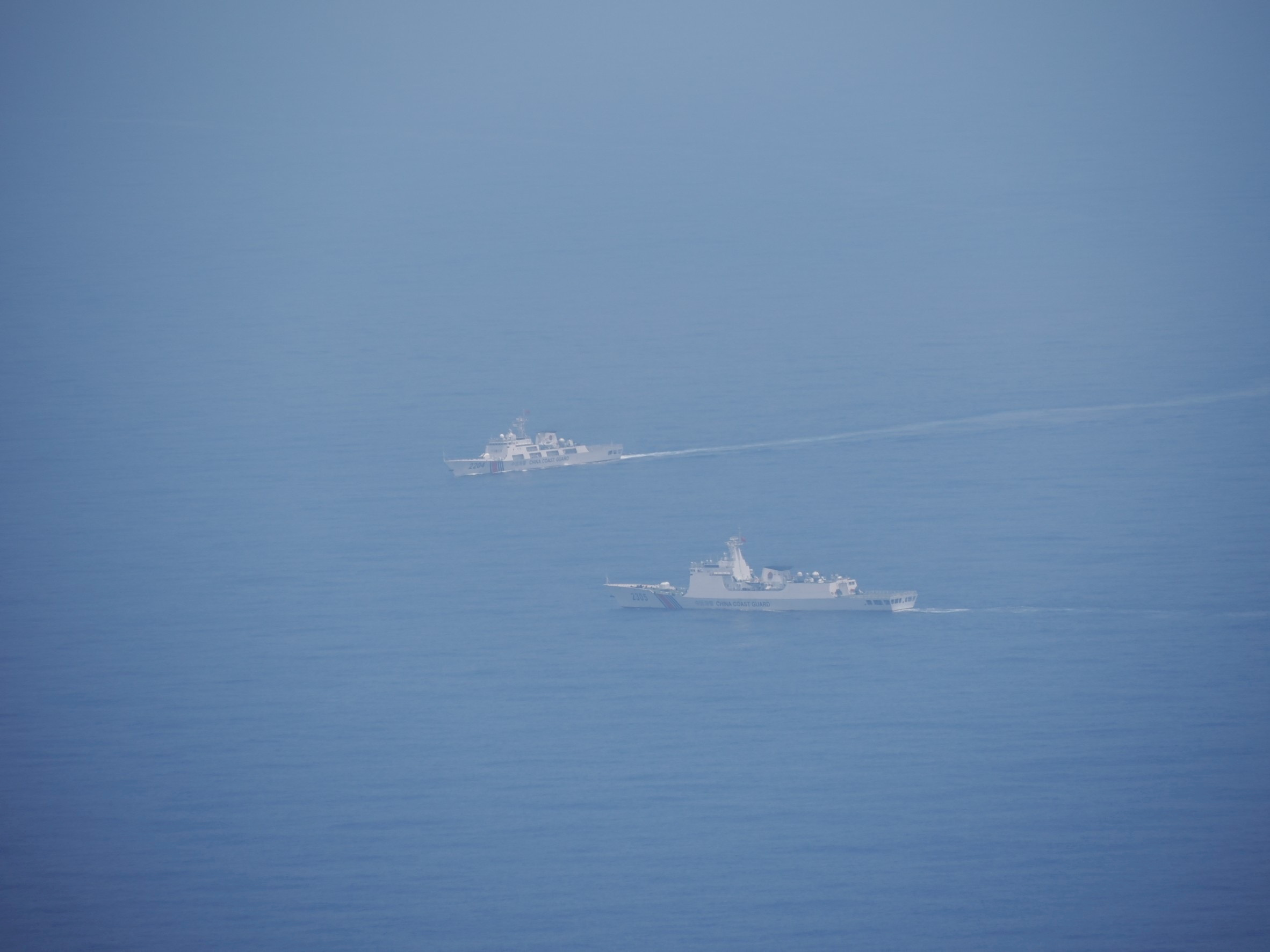 Chinese coastguard vessels are pictured while navigating at an undisclosed location in waters around Taiwan