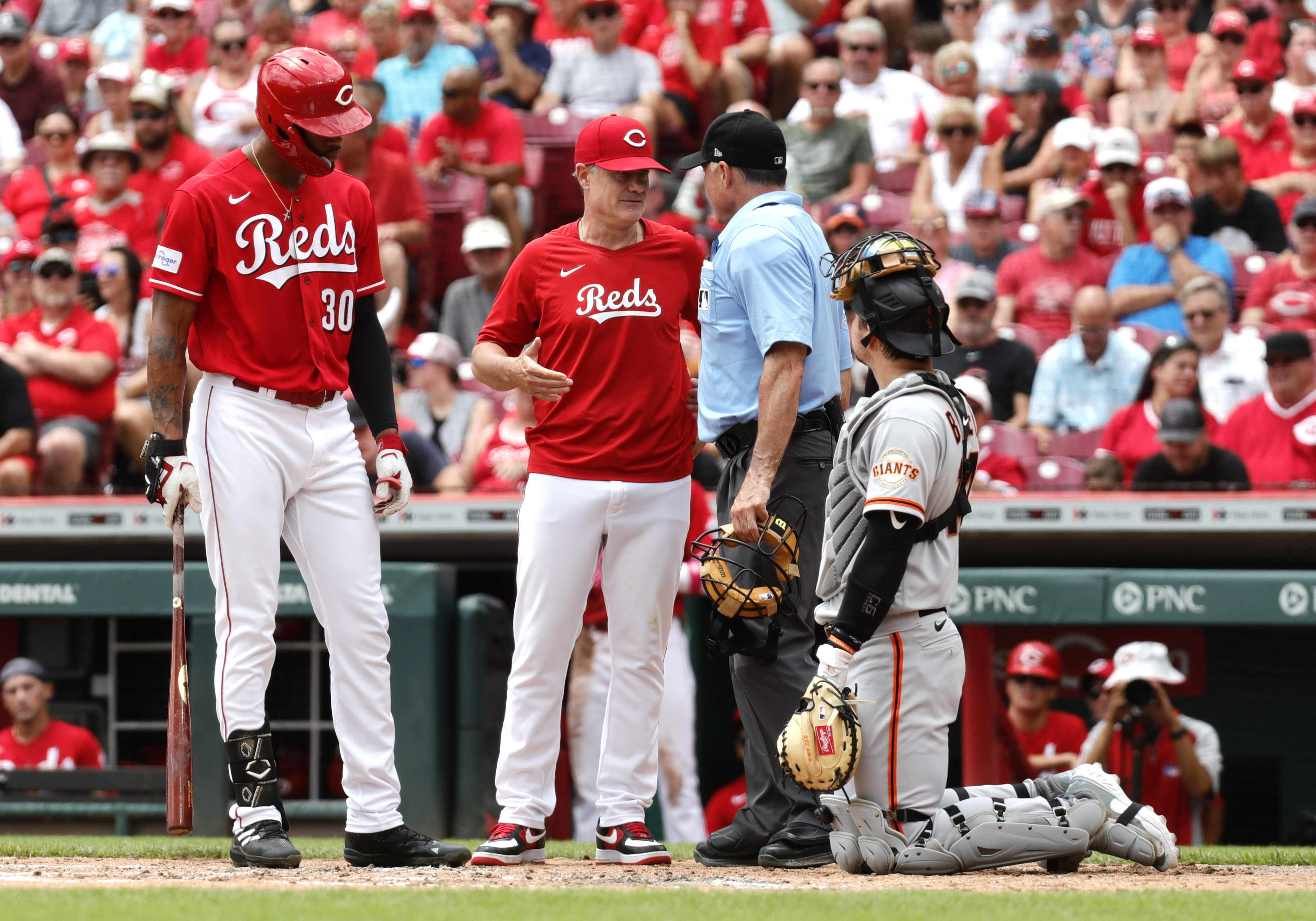 Cincinnati Reds' Will Benson (30) celebrates with Christian