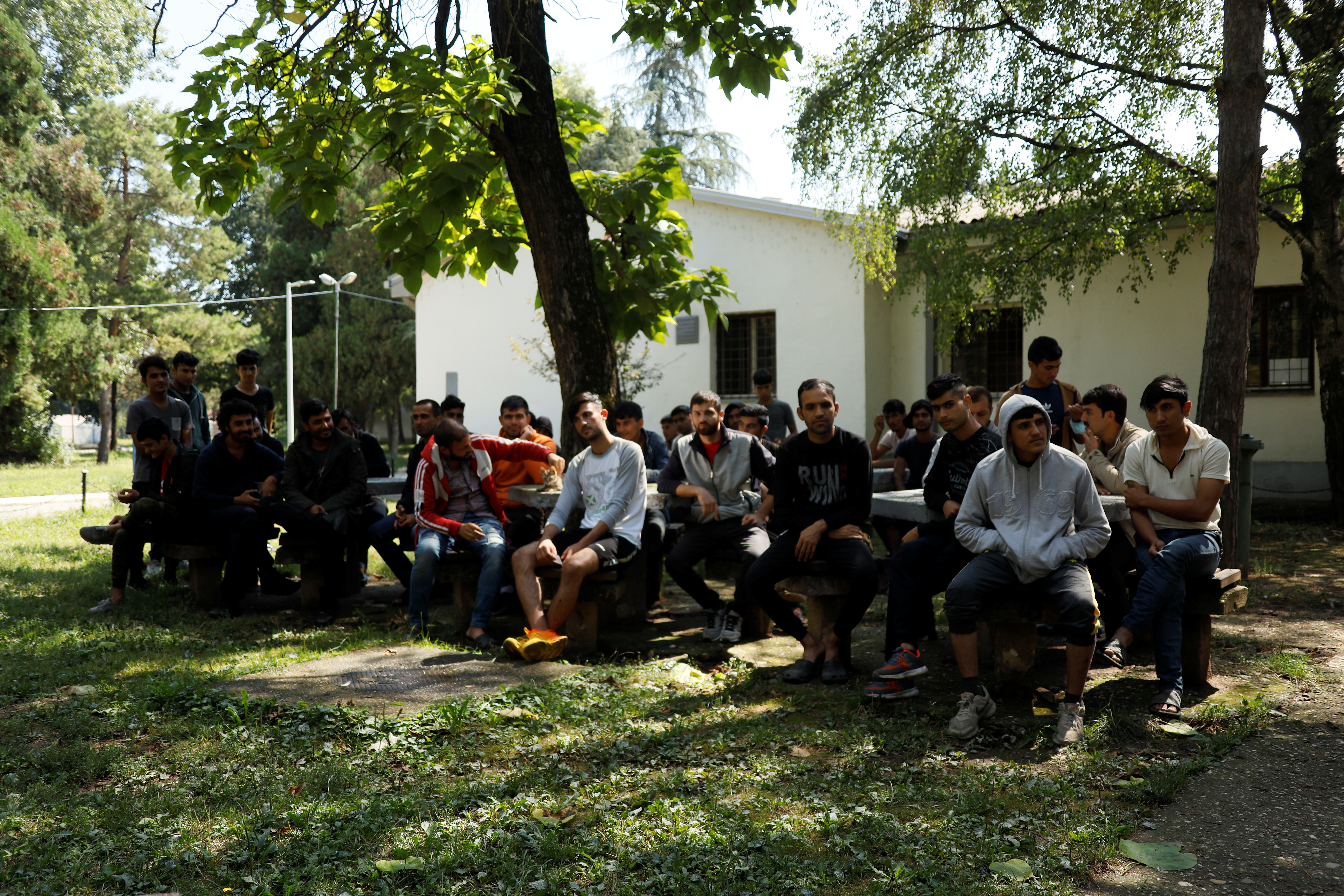 Afghan migrants are seen at a camp in Obrenovac, near Belgrade
