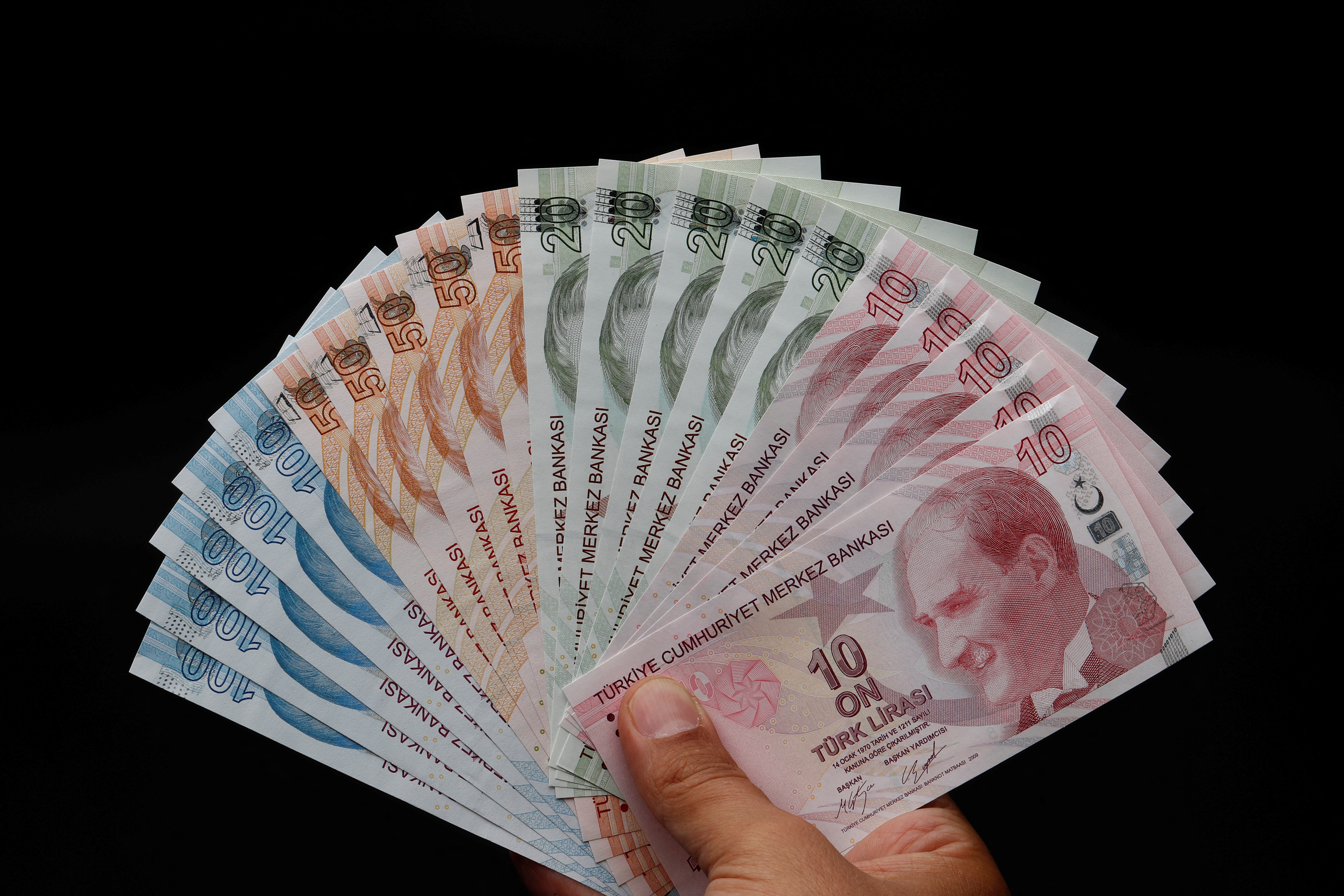 Turkish lira banknotes are seen in this picture illustration in Istanbul