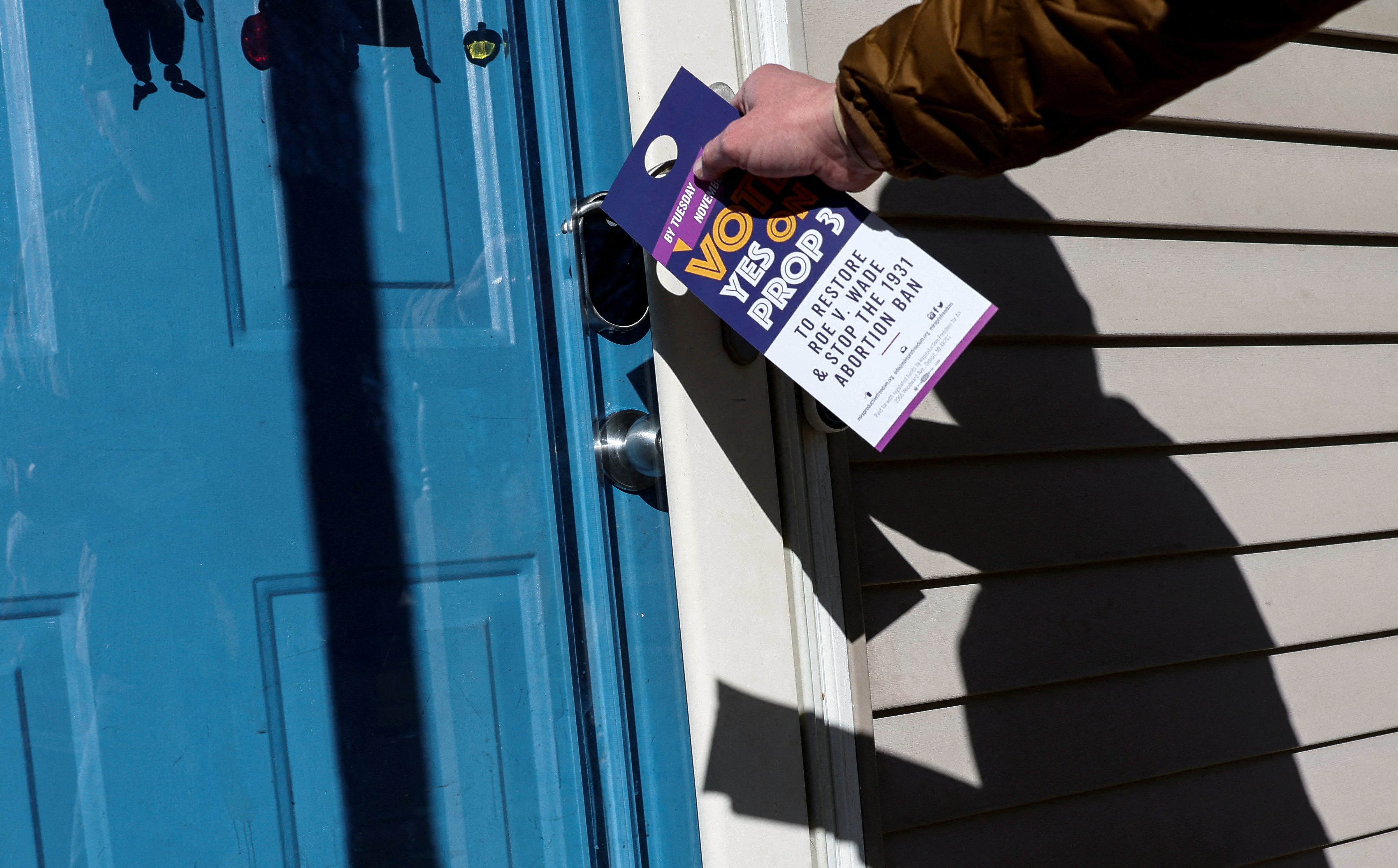 Canvassers in support of abortion rights knock on doors ahead of the midterm election in Michigan