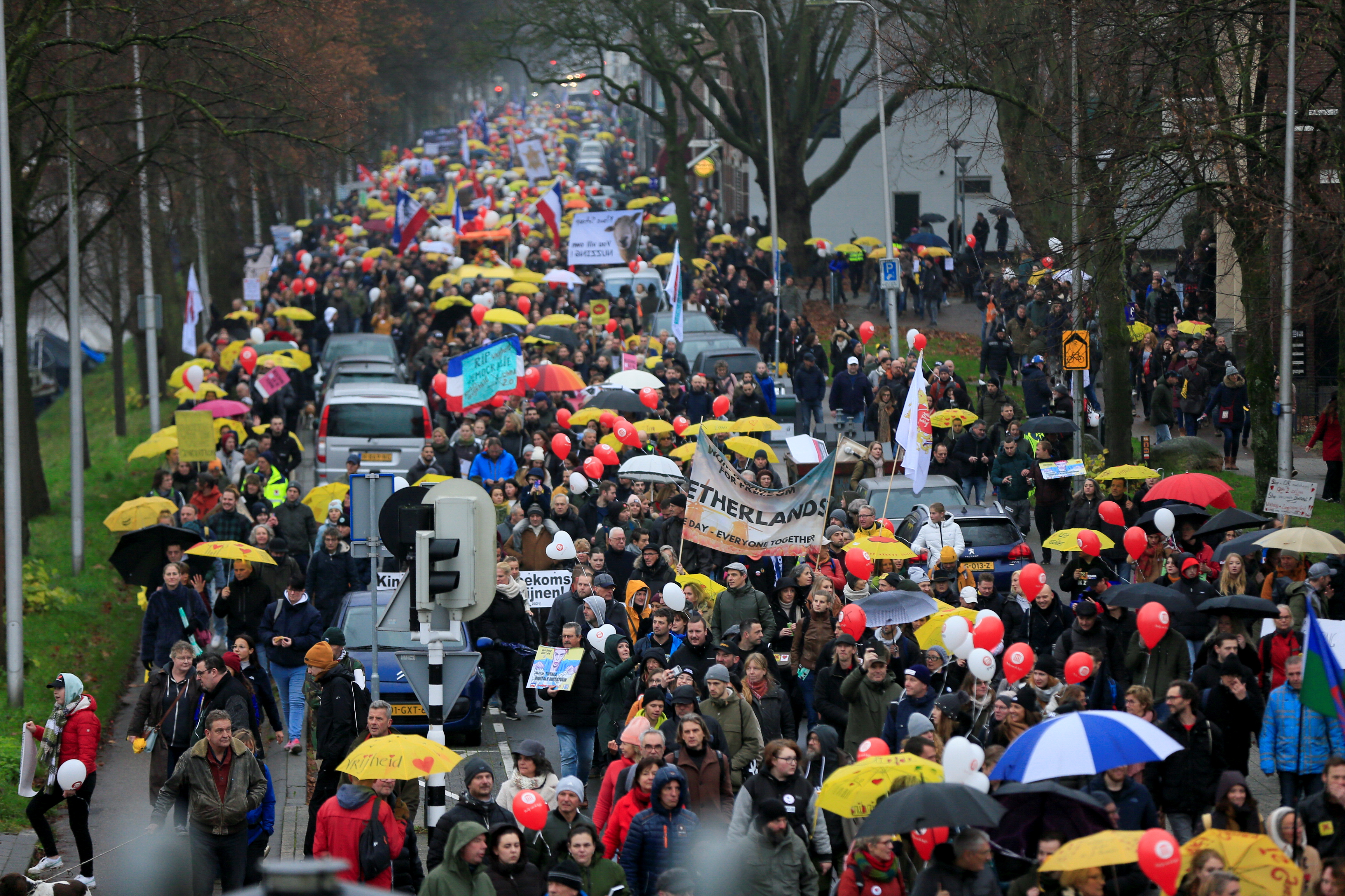 Thousands protest over Dutch coronavirus restrictions | Reuters