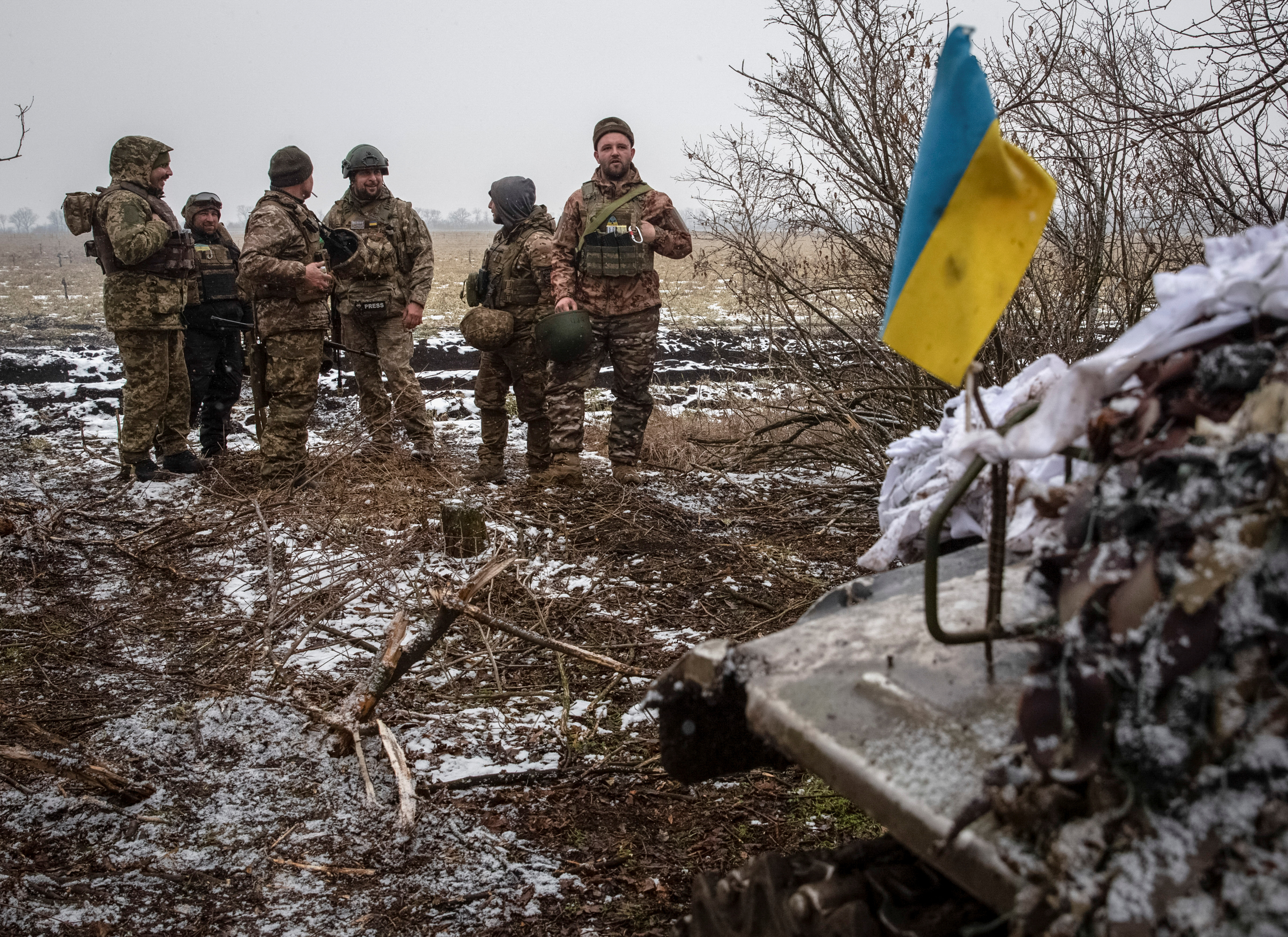 Ukrainian servicemen stand at their positions near a front line in Donetsk region