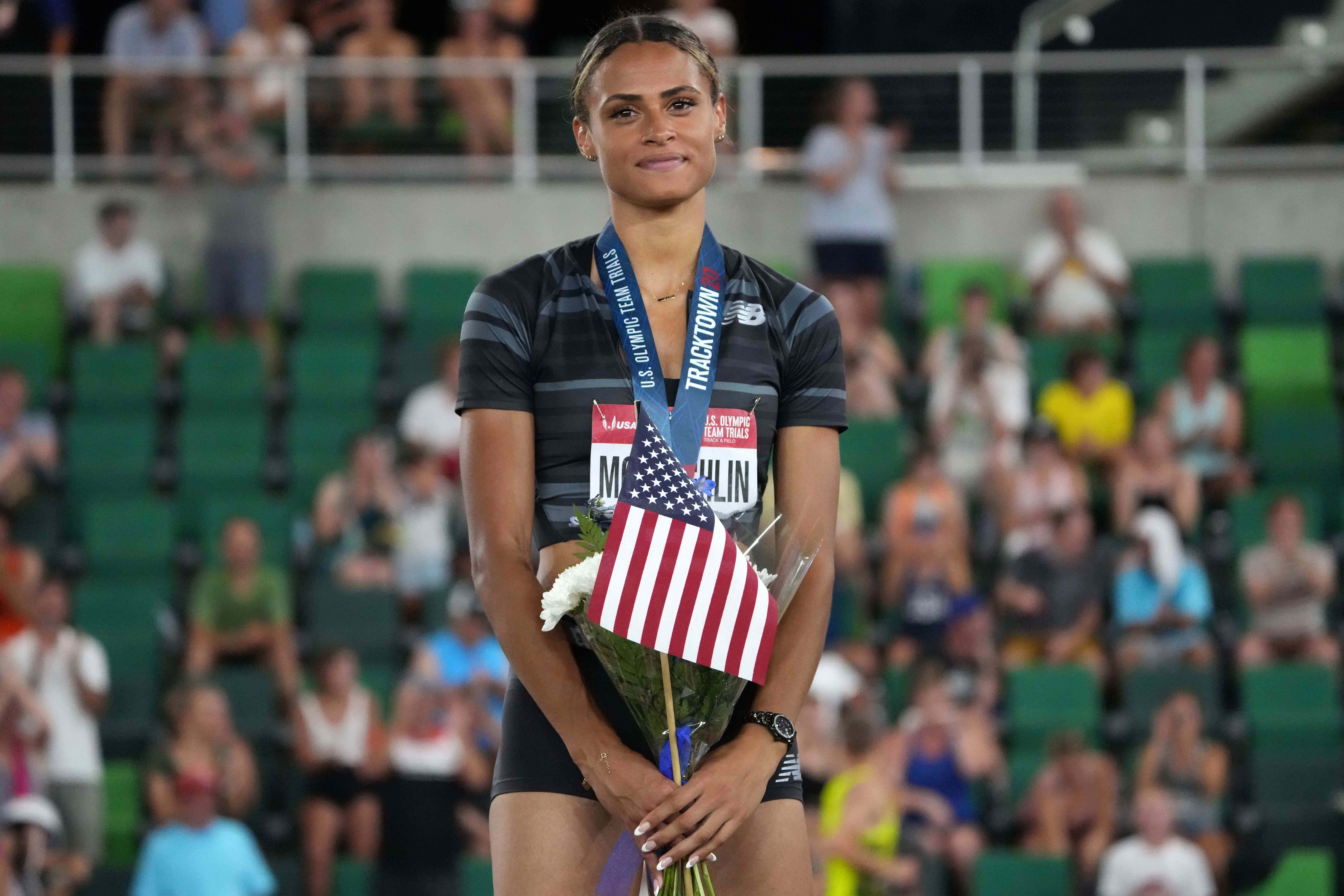Jun 27, 2021; Eugene, OR, USA; Sydney McLaughlin poses with gold medal after winning the women's 400m hurdles in a world-record 51.90 during the US Olympic Team Trials at Hayward Field. Mandatory Credit: Kirby Lee-USA TODAY Sports
