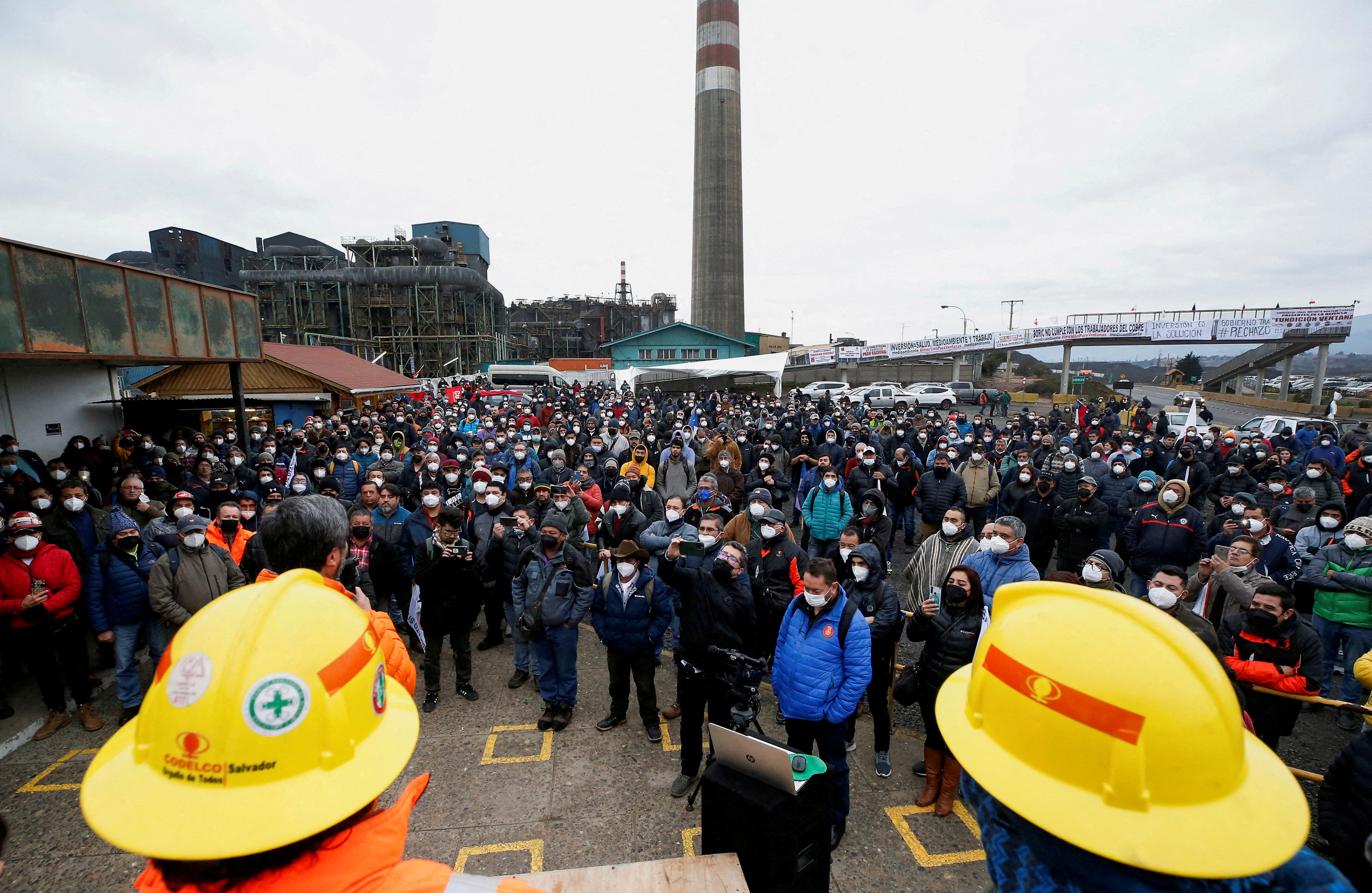 Workers of Codelco's Ventanas copper smelter take part in a rally in support of their job positions outside the smelter, in Ventanas